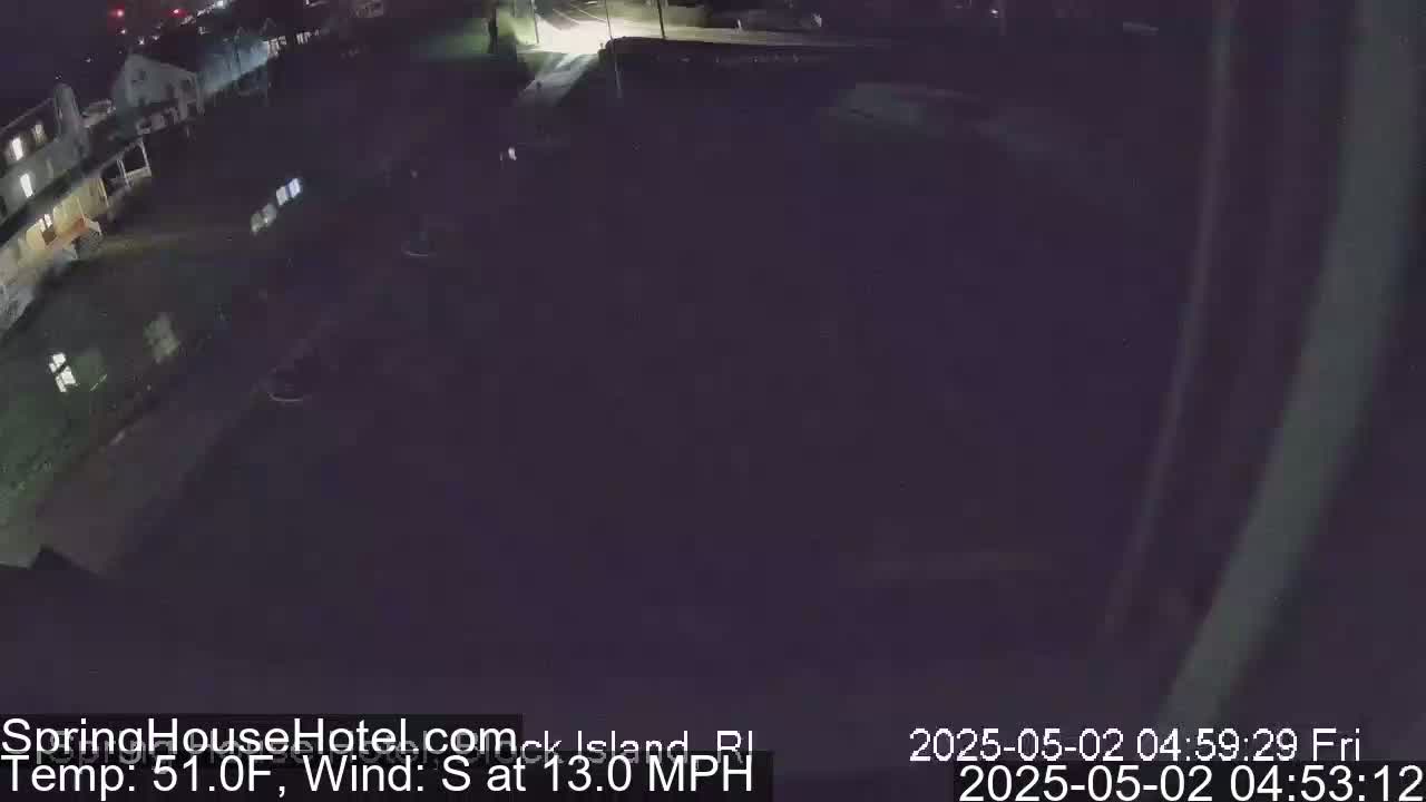 A nighttime, high-angle view of a residential area with a south wind at 13 mph and a temperature of 51°F.