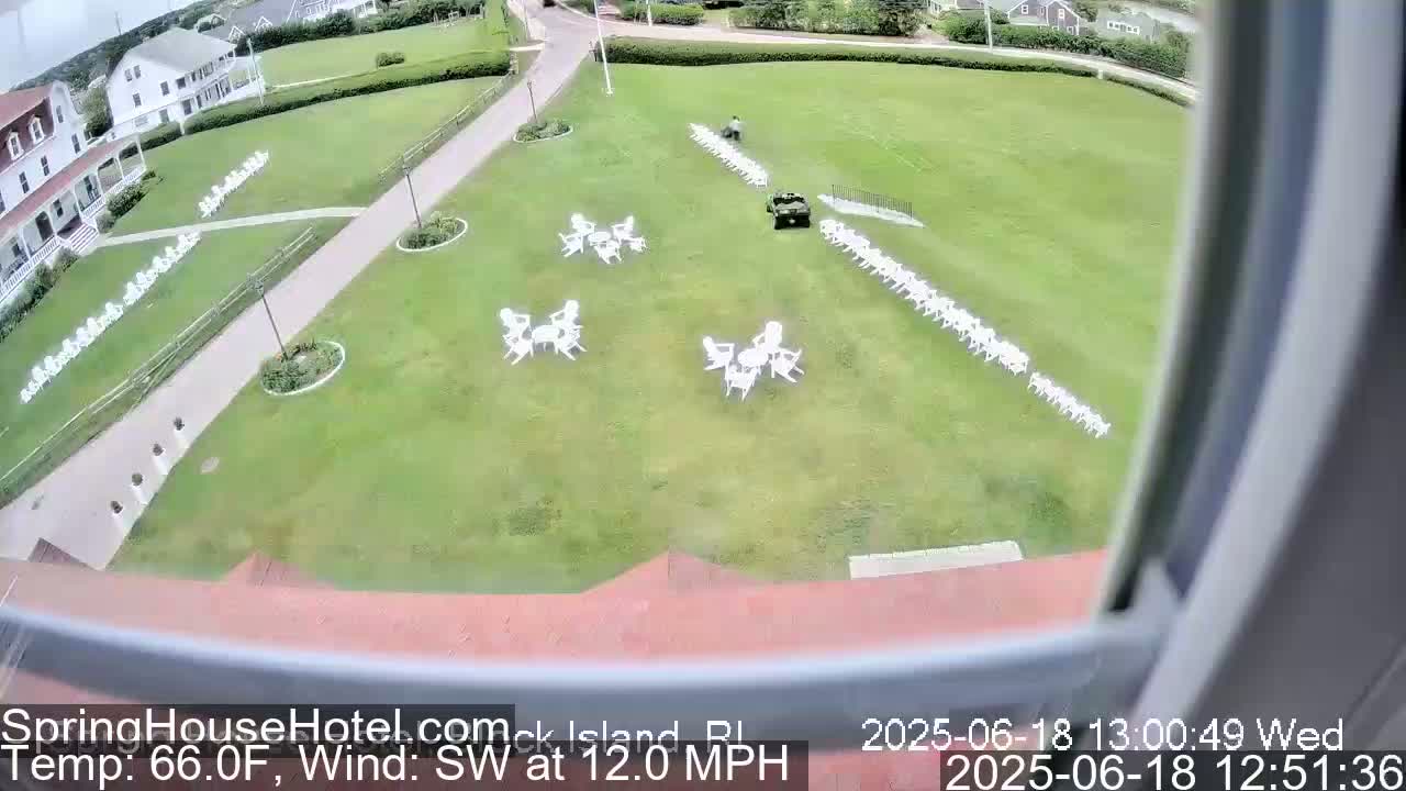 An aerial view shows a grassy area with white chairs arranged in rows and small groups, a golf cart, and a person, all under a partly cloudy sky with a southwest wind at 12 mph and a temperature of 66°F.