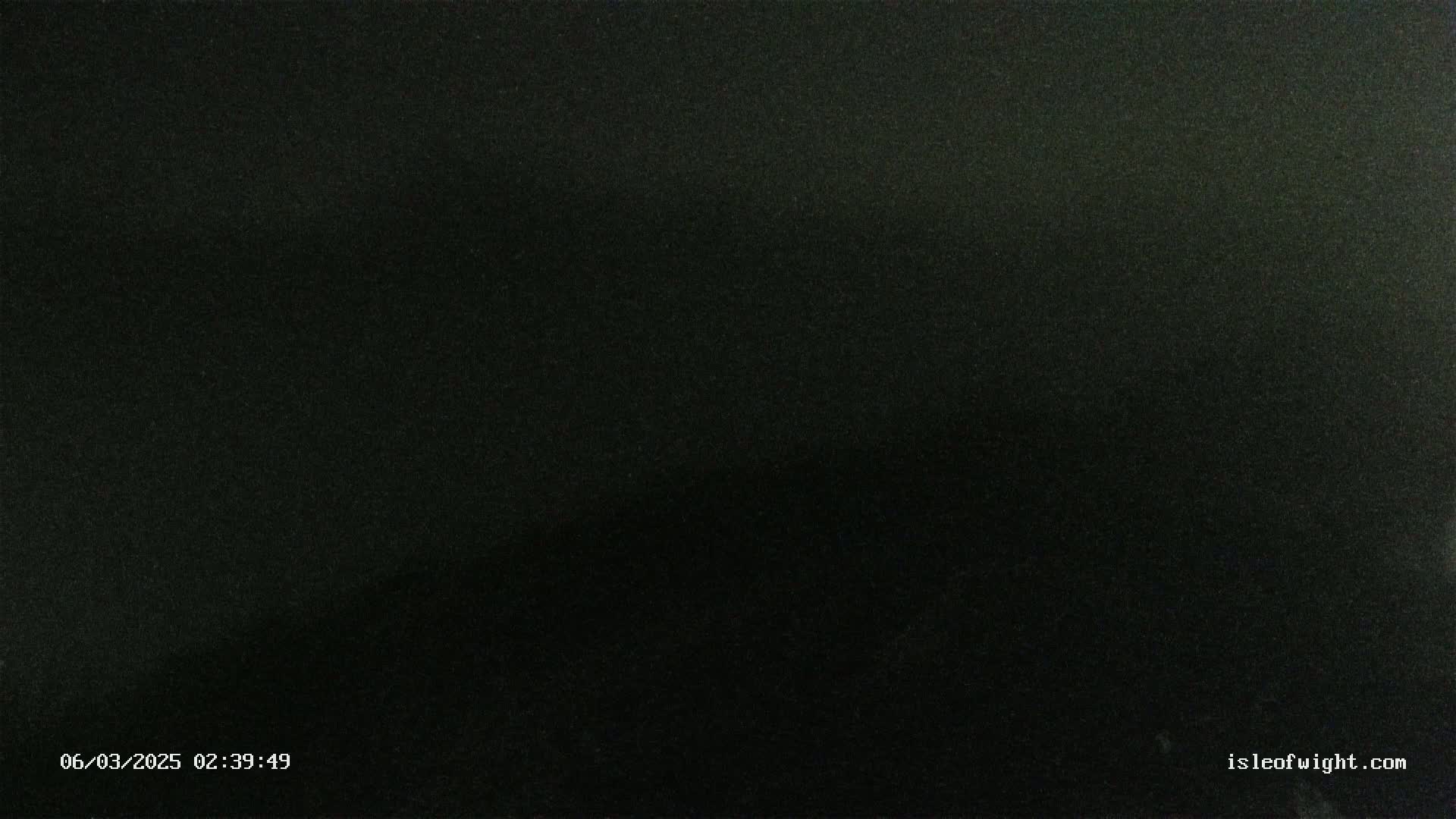 The image shows a completely dark scene at night.