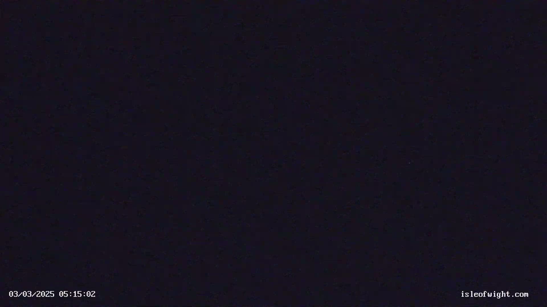 The image shows a uniformly dark, almost black, nighttime sky.