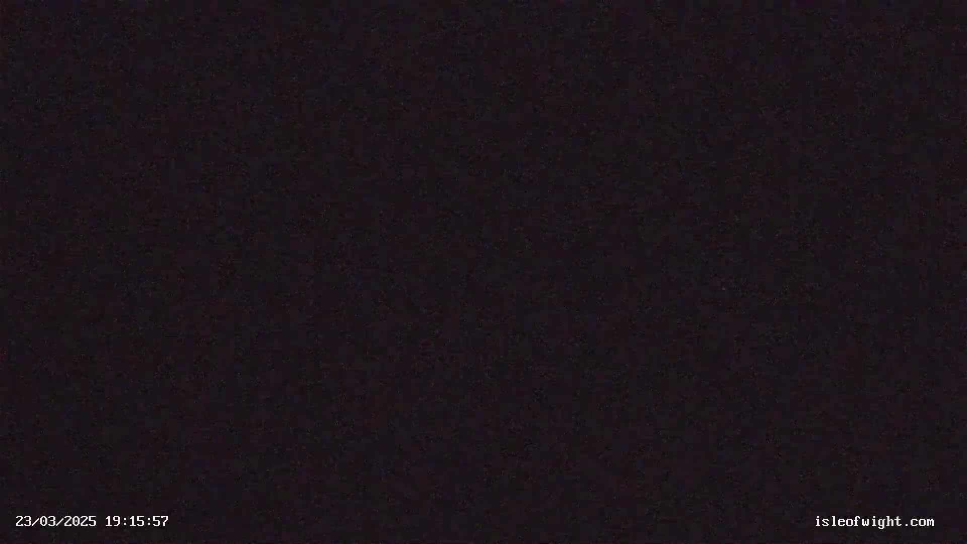 The image shows a completely black, grainy screen.