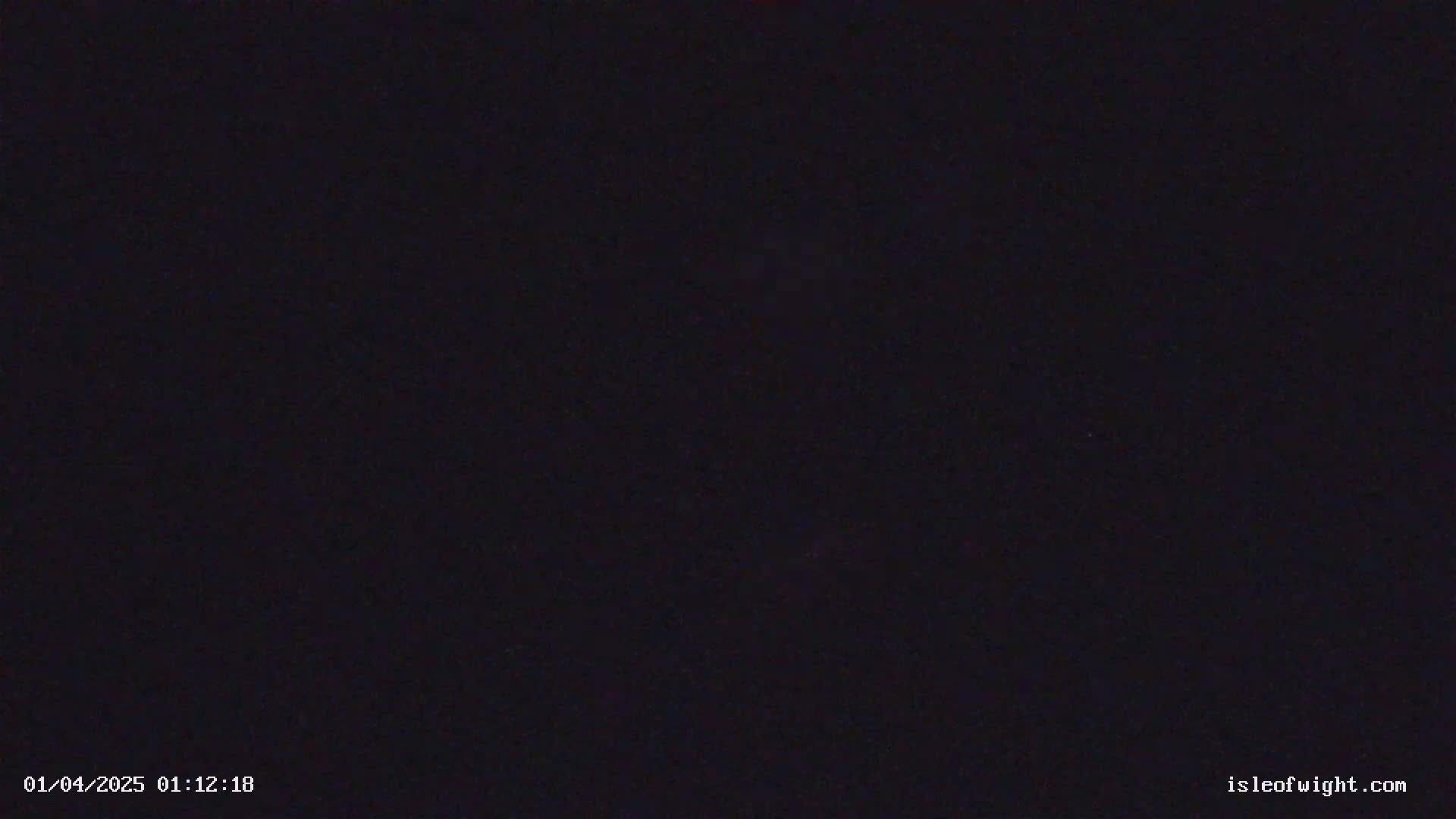 The image shows a completely dark, nighttime scene.