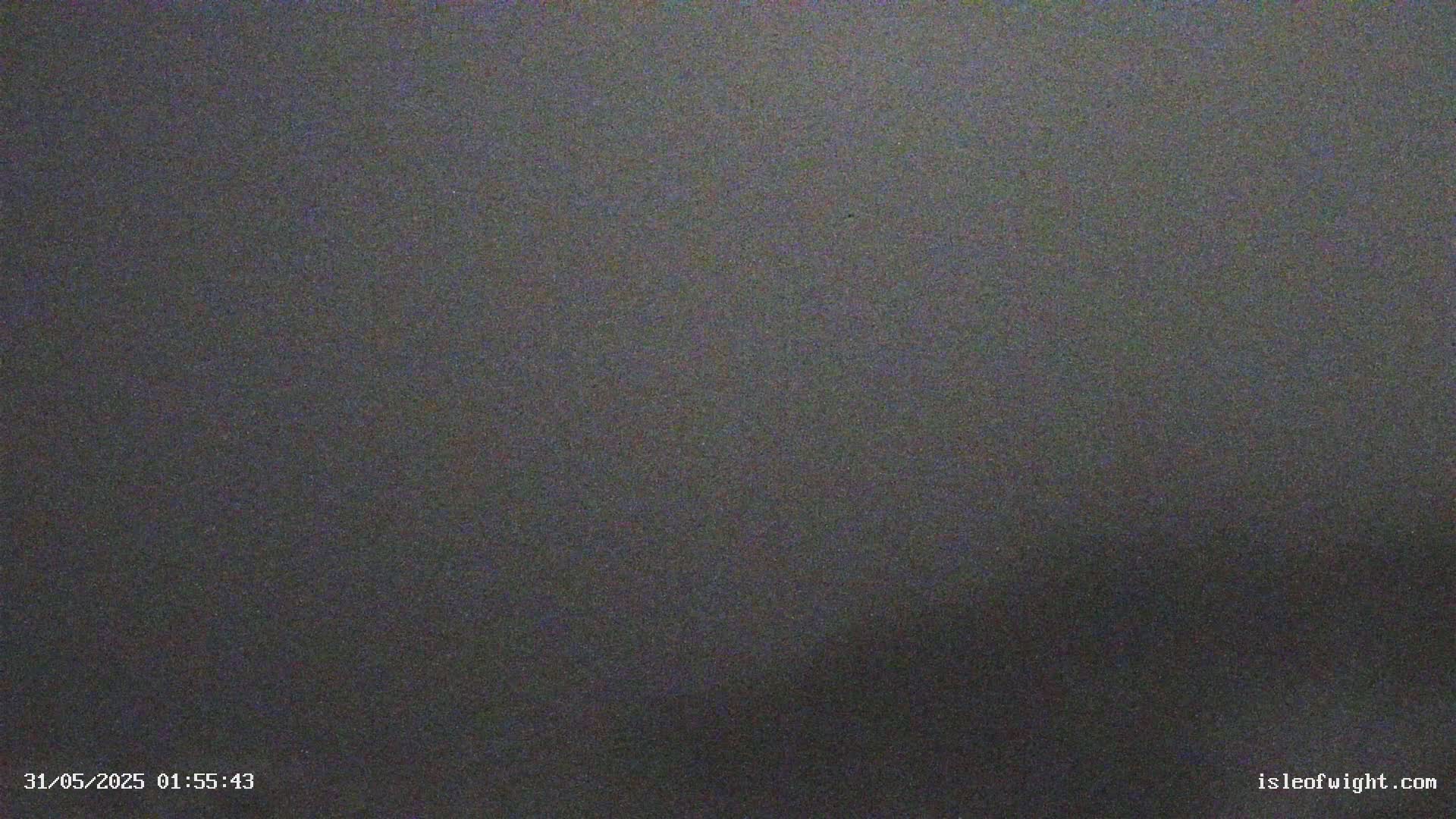 The image shows a dark gray, textured surface.