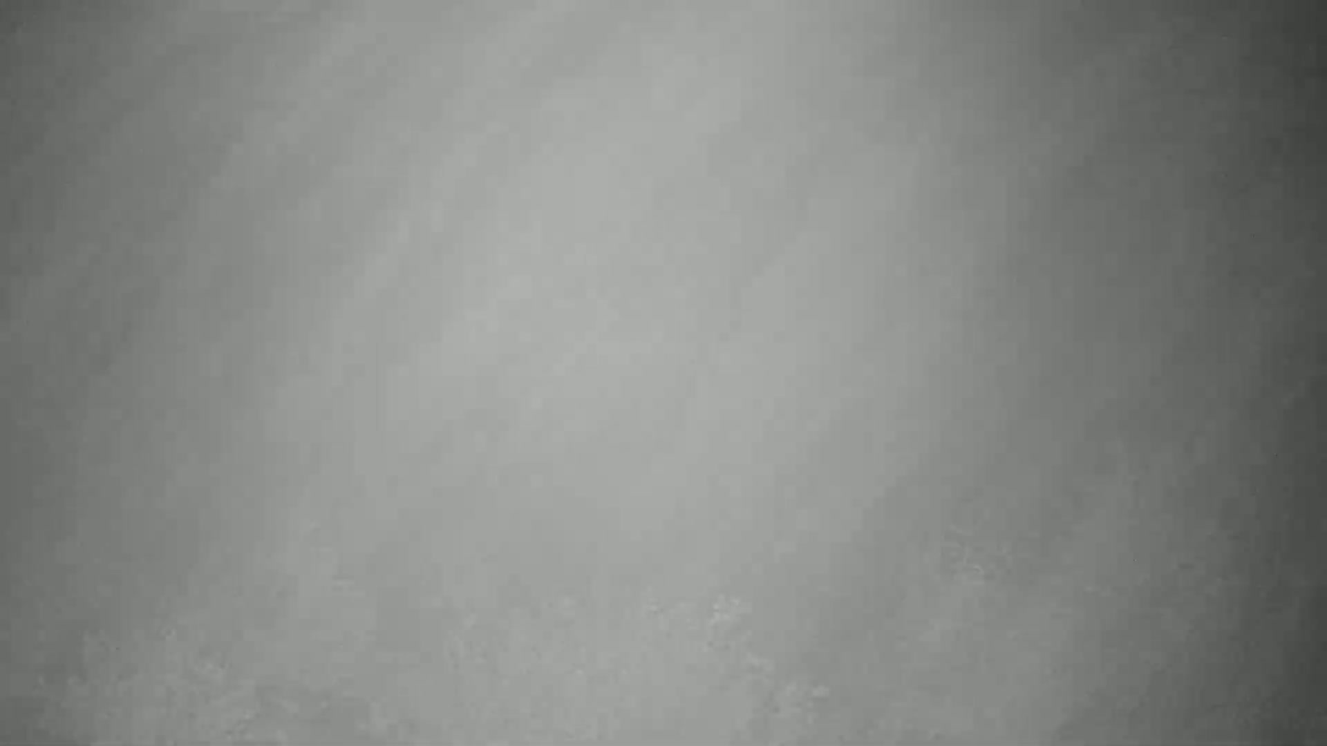 A uniformly gray textured surface fills the image.