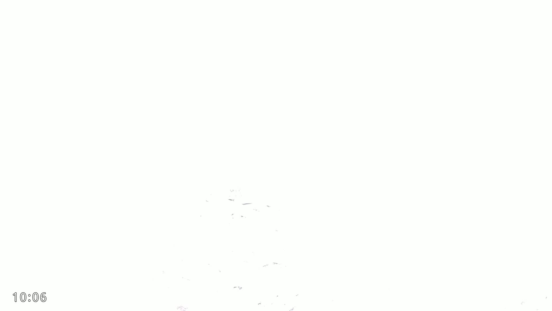 A mostly white image shows a few faint, scattered specks of gray.