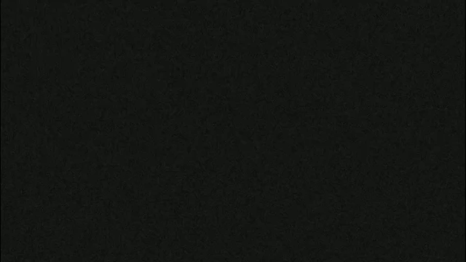 The image is a solid dark-grey background with a slightly textured appearance.