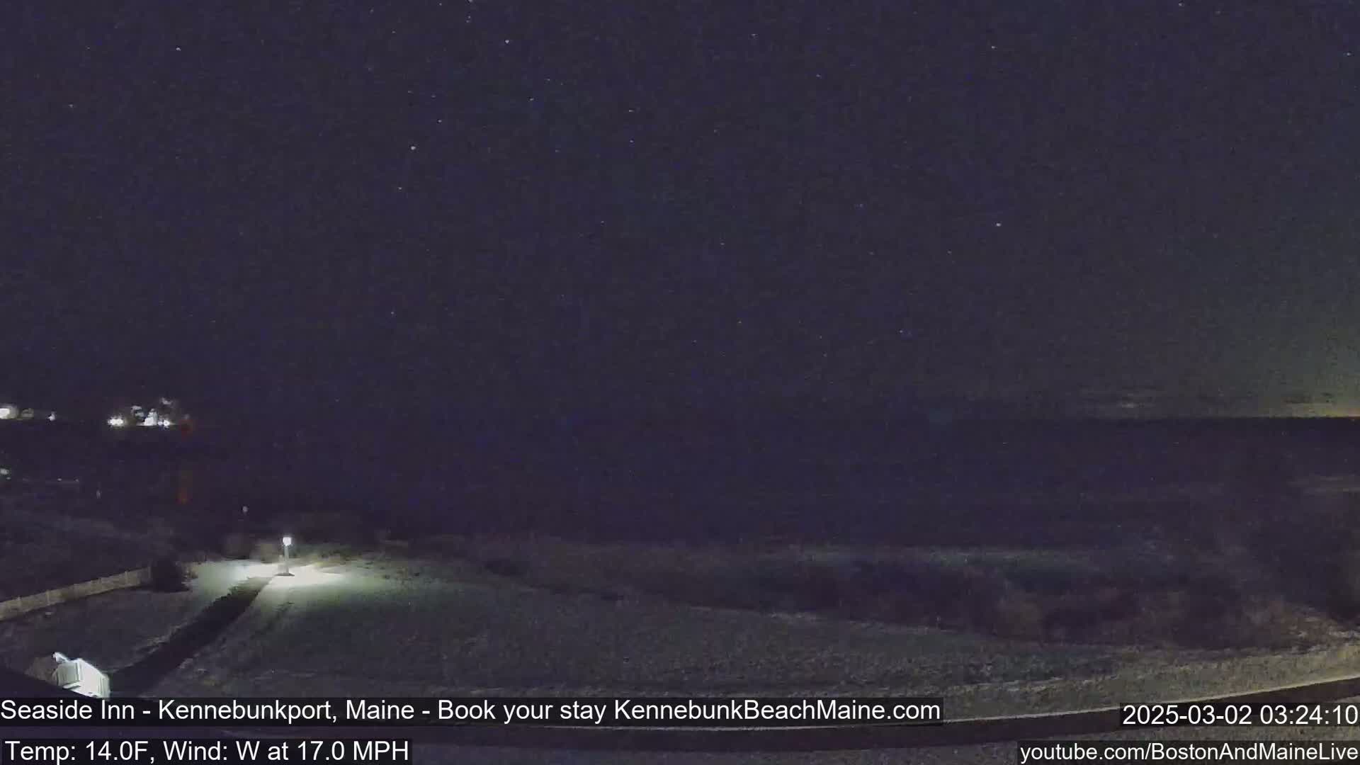 A snow-covered landscape is visible at night under a starry sky, with a wind of 17 mph.