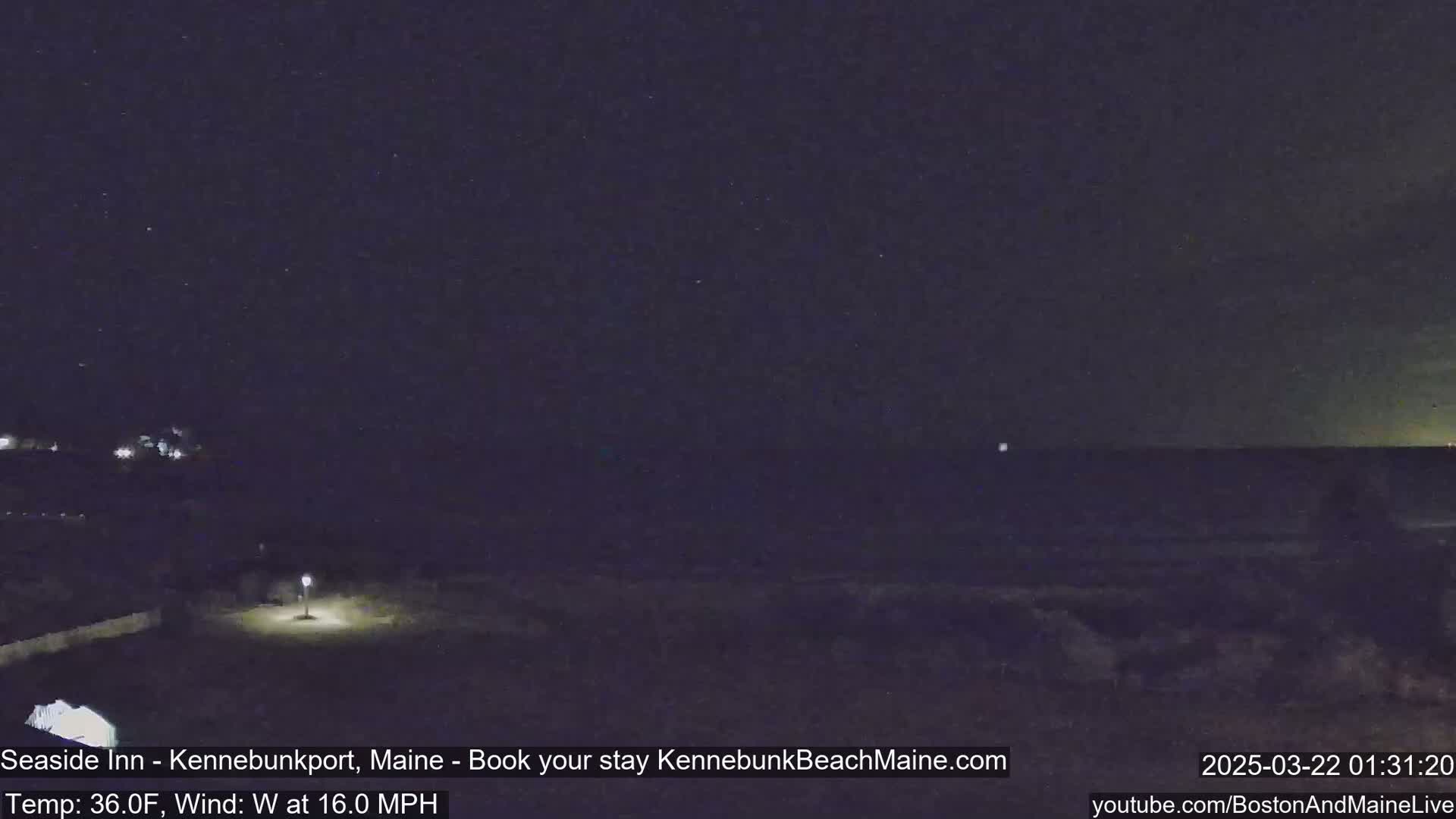 A nighttime view of a dark ocean under a starry sky with a 16 mph westerly wind and a temperature of 36 degrees Fahrenheit.