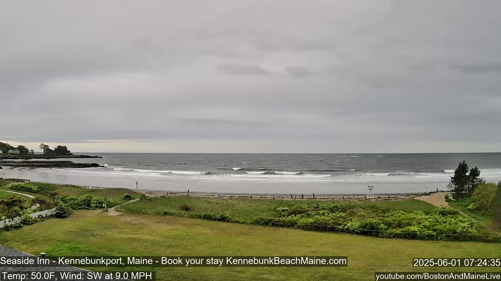 A beach with small waves under an overcast sky.