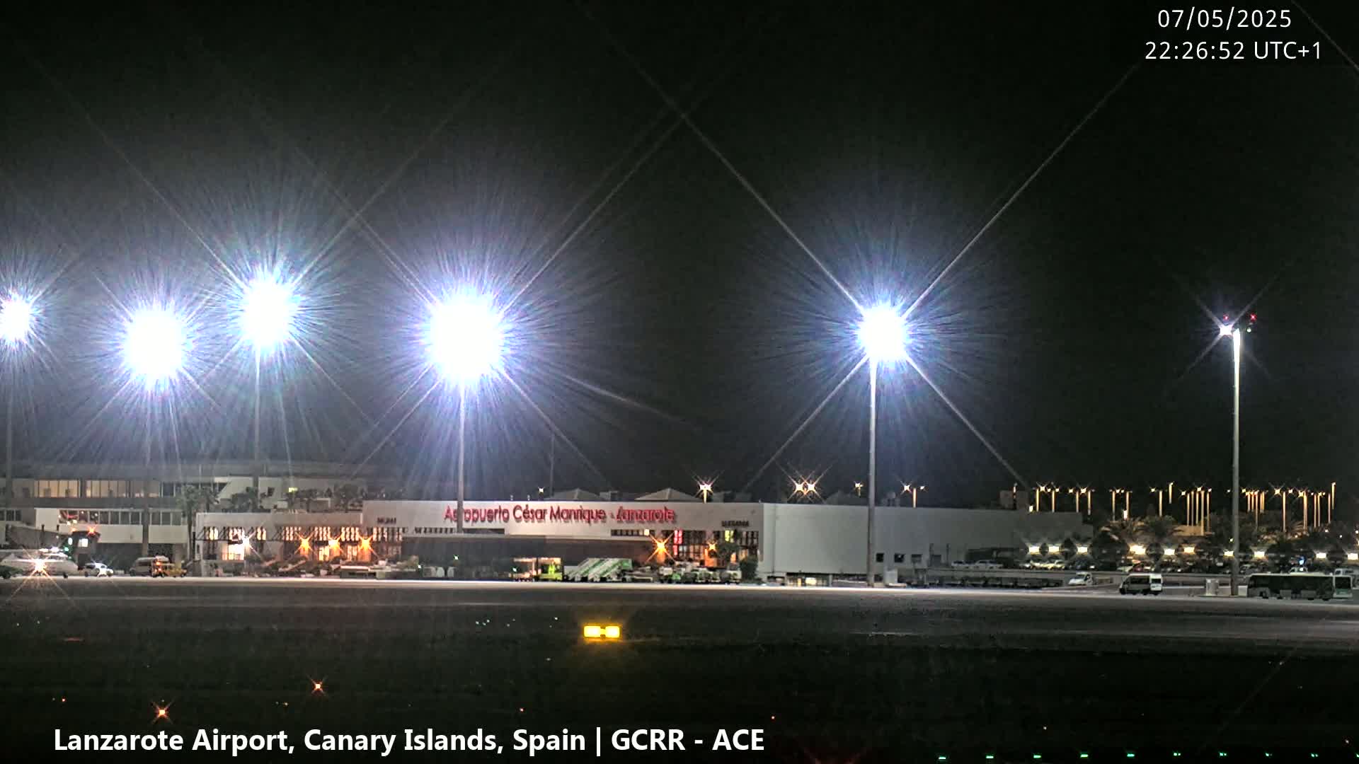 A brightly lit airport at night.