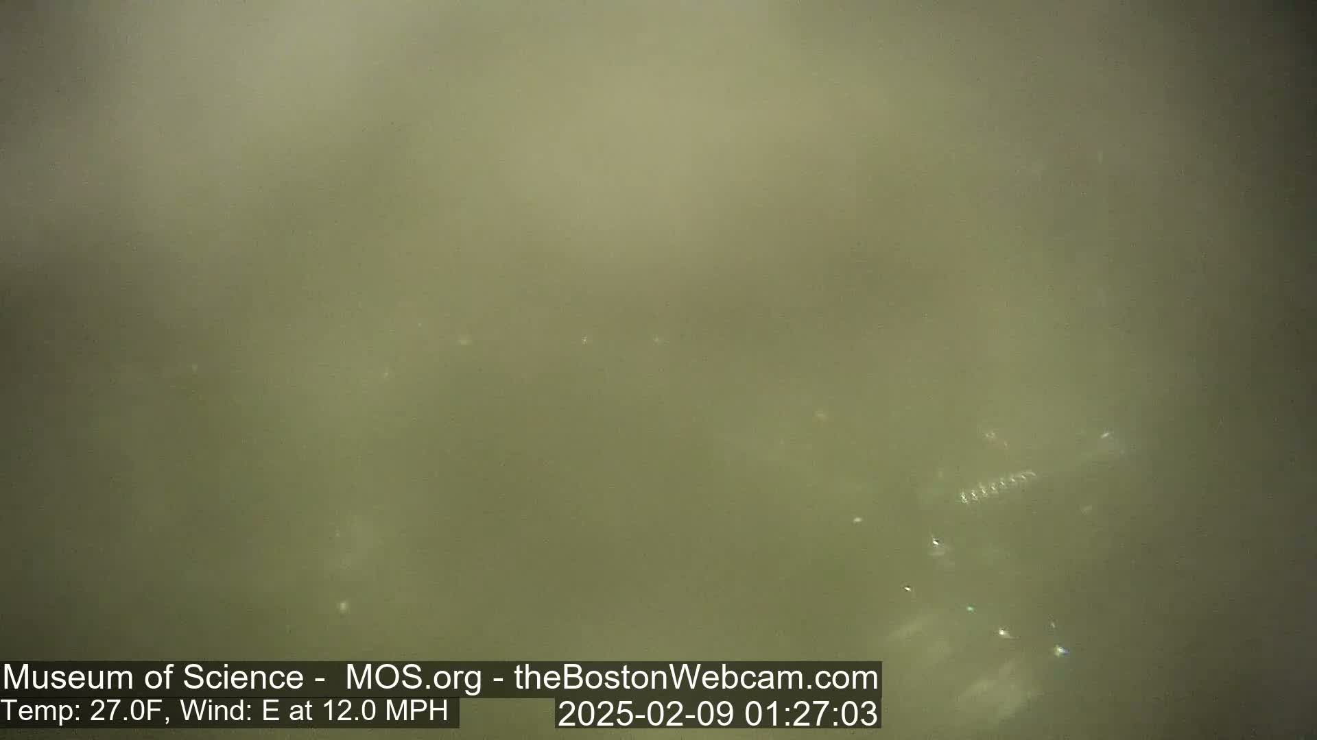 A hazy, muted green outdoor scene is visible, with a 27°F temperature and an easterly wind at 12 mph.
