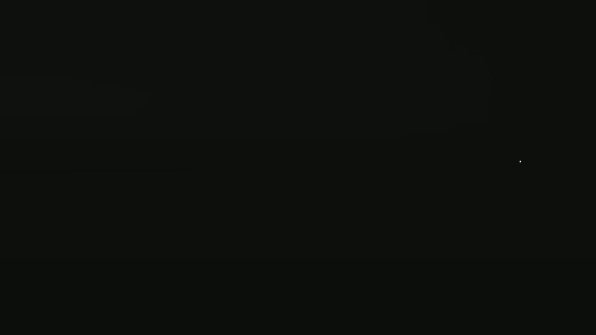 A single, faint light is visible in an otherwise completely dark night sky.