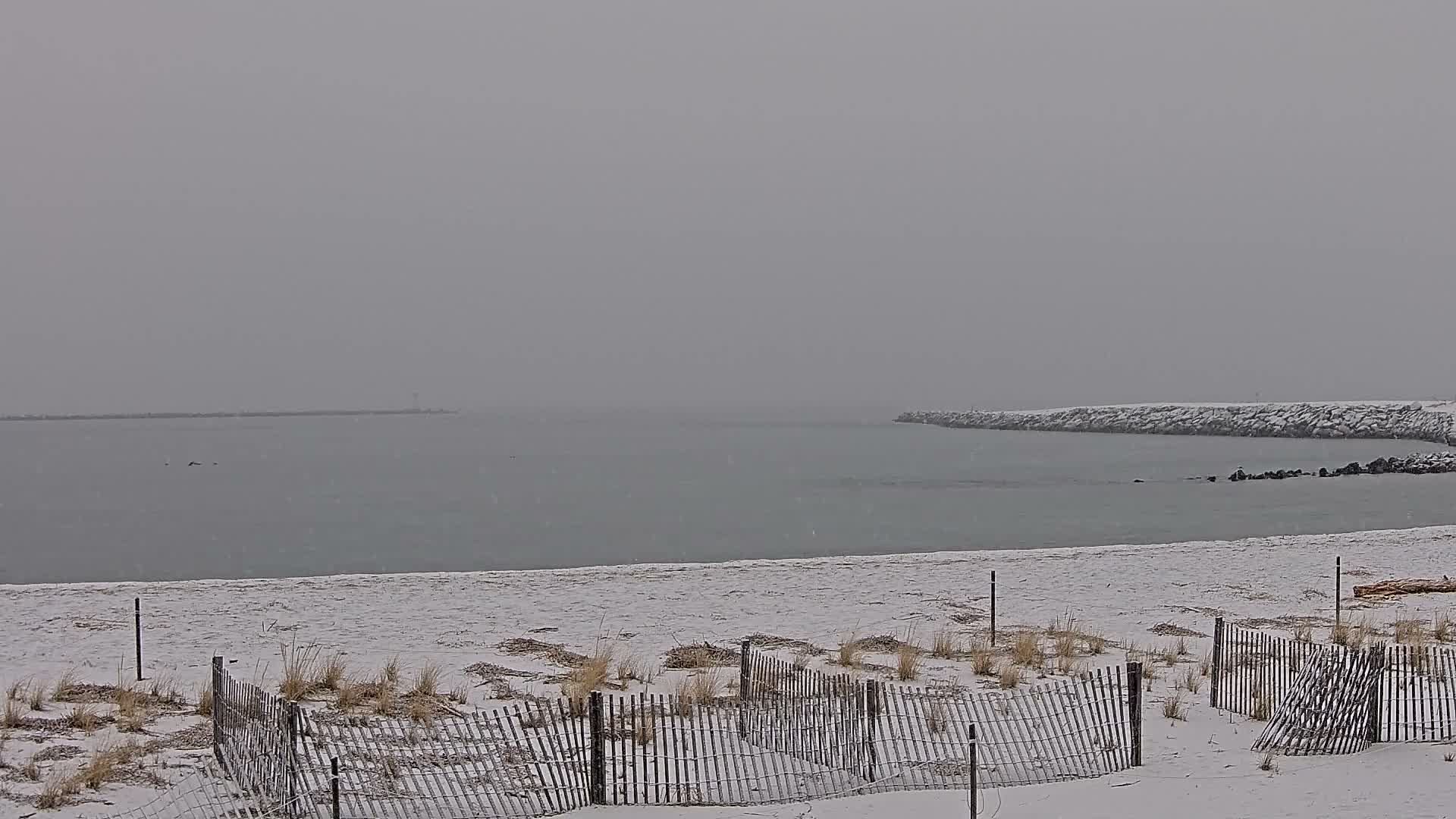 A dark night sky is dotted with a few faint stars under clear conditions.