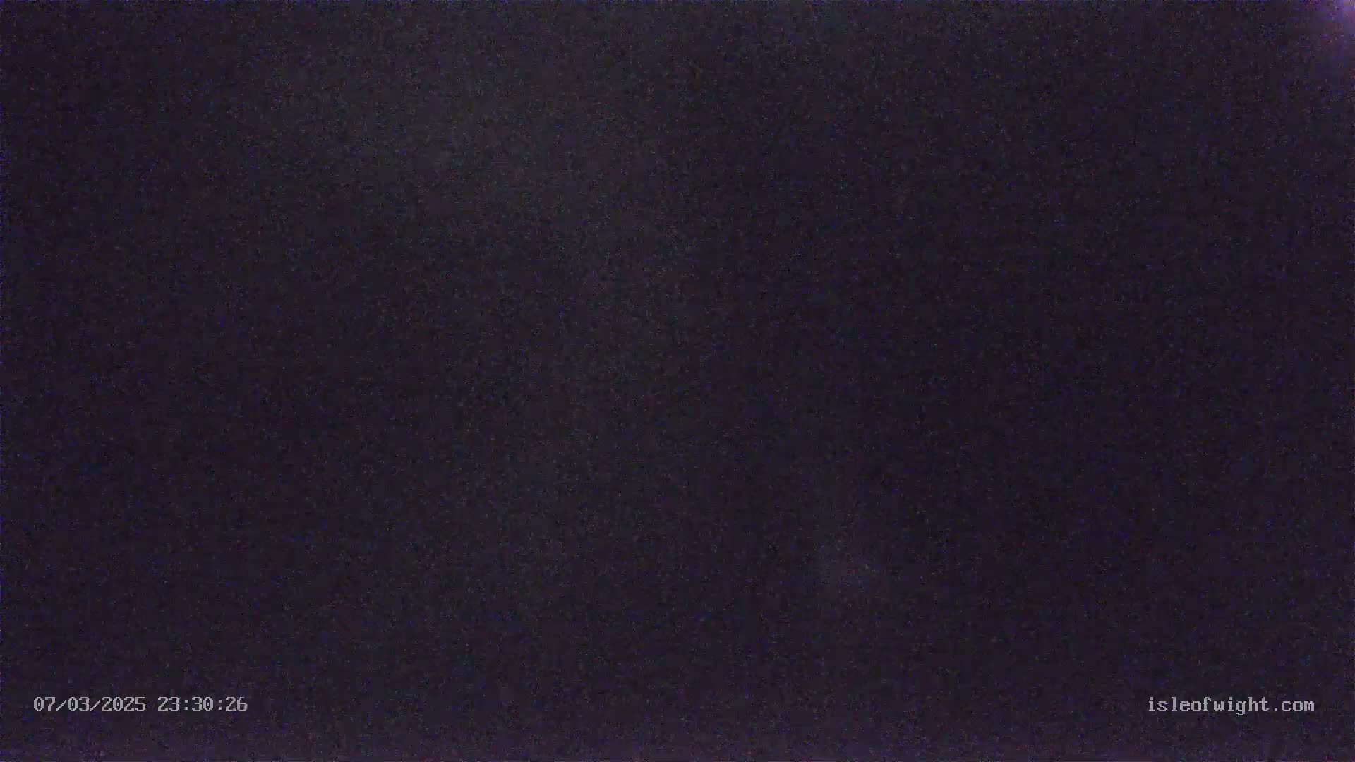 A dark, nighttime sky is visible, showing a faint scattering of stars.