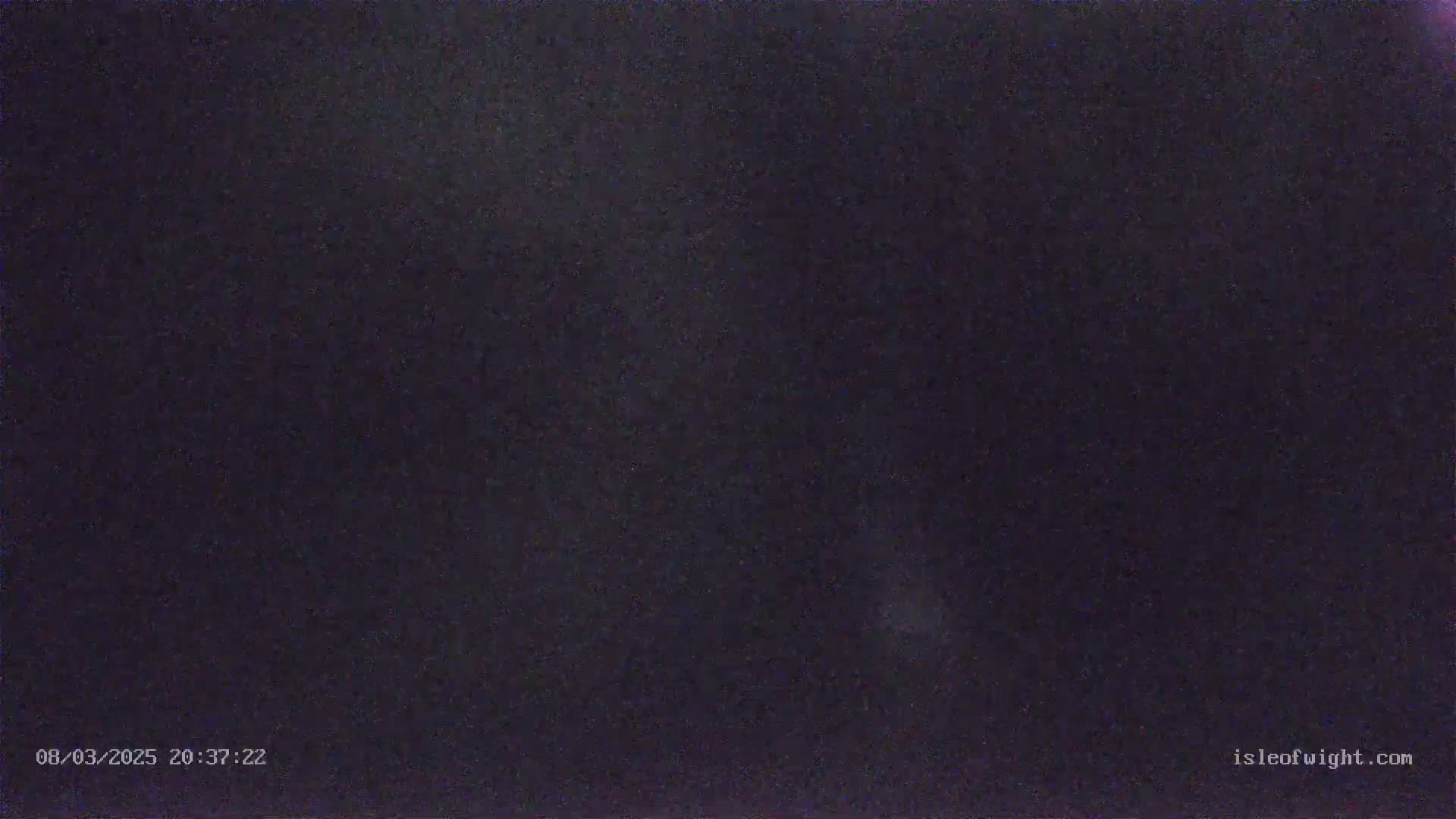 A dark, night sky is visible, showing a few faint stars.