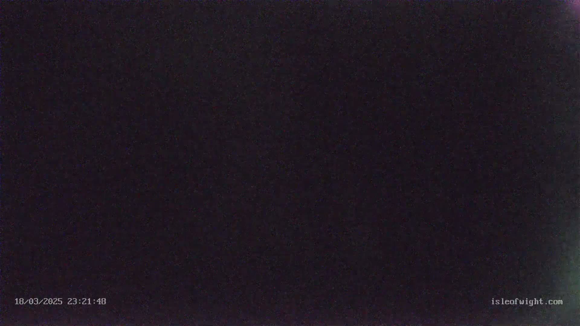 The image shows a completely dark nighttime scene.