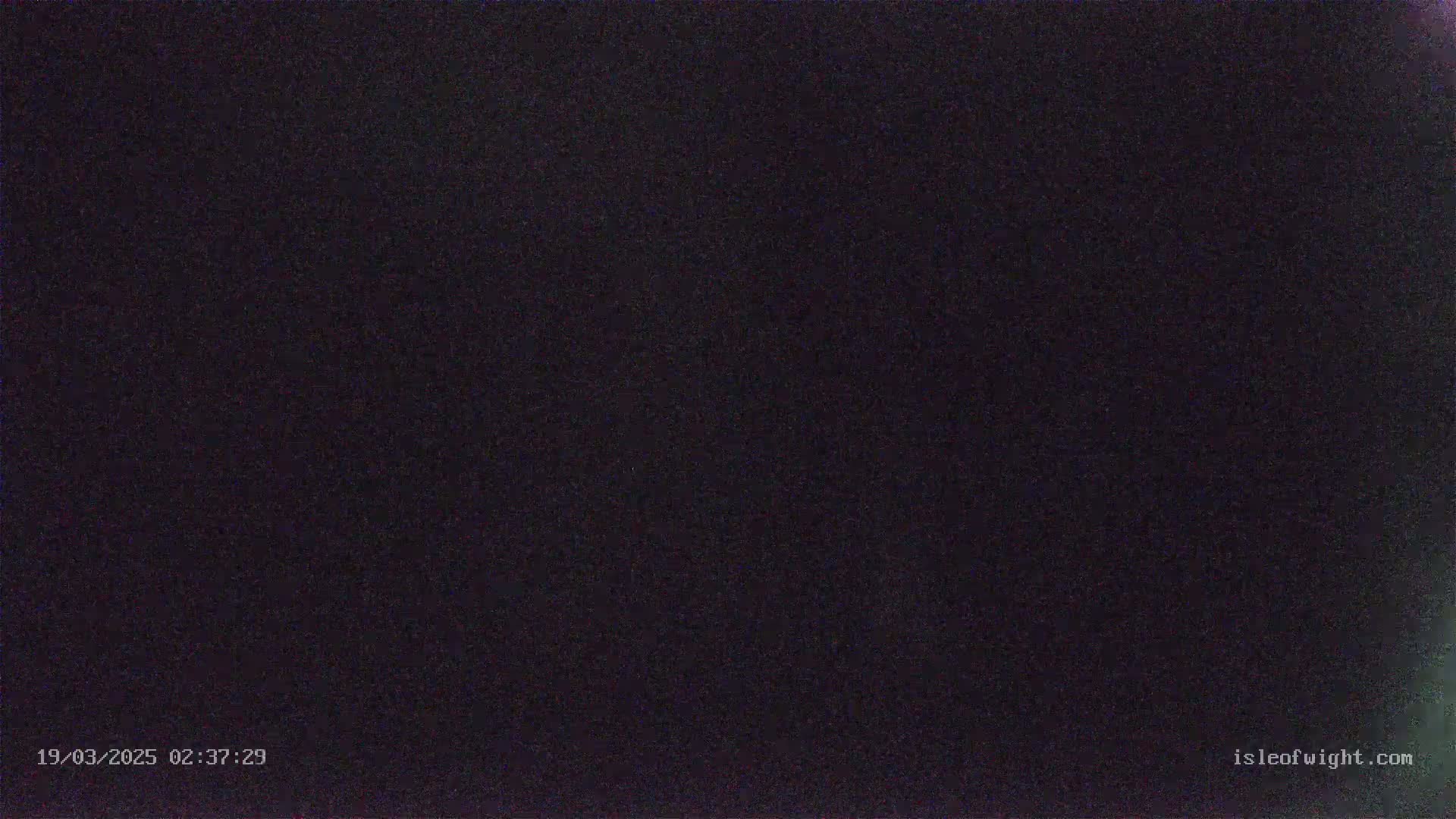 The image shows a completely dark scene at night.