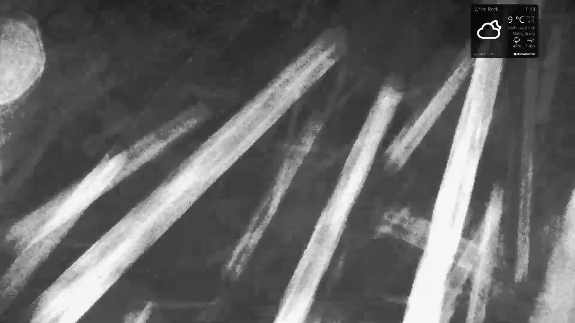A mostly cloudy night scene depicts a grayscale abstract painting of diagonal white streaks on a dark background, with a large, pale circle near the top left.