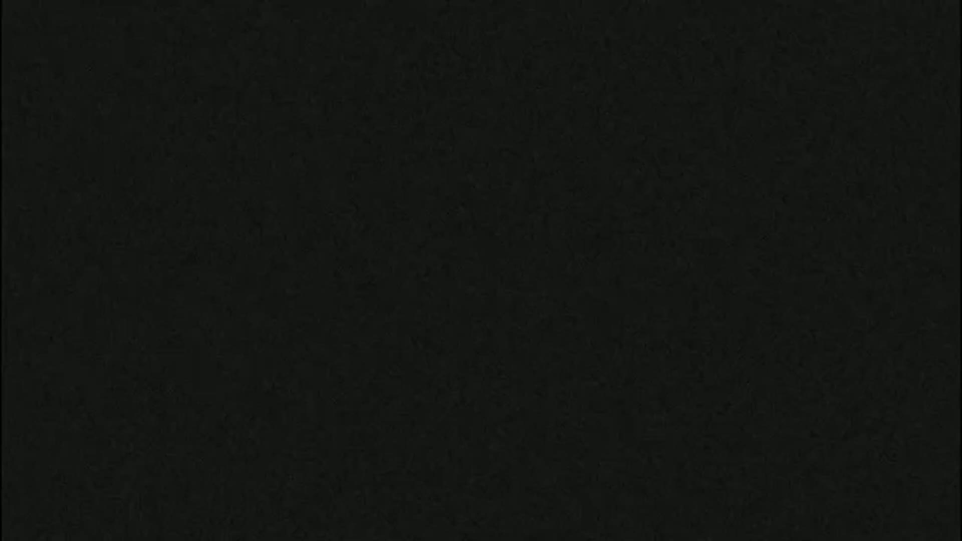 The image is a solid dark-grey/black textured background.