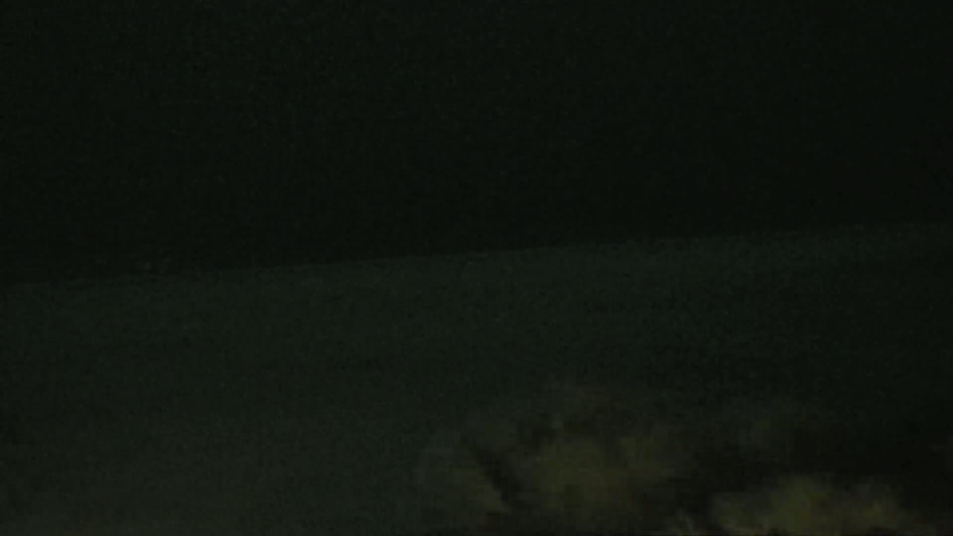 A dark, possibly nighttime, scene shows a blurry, light-colored area at the bottom that could be fog or low-lying clouds.