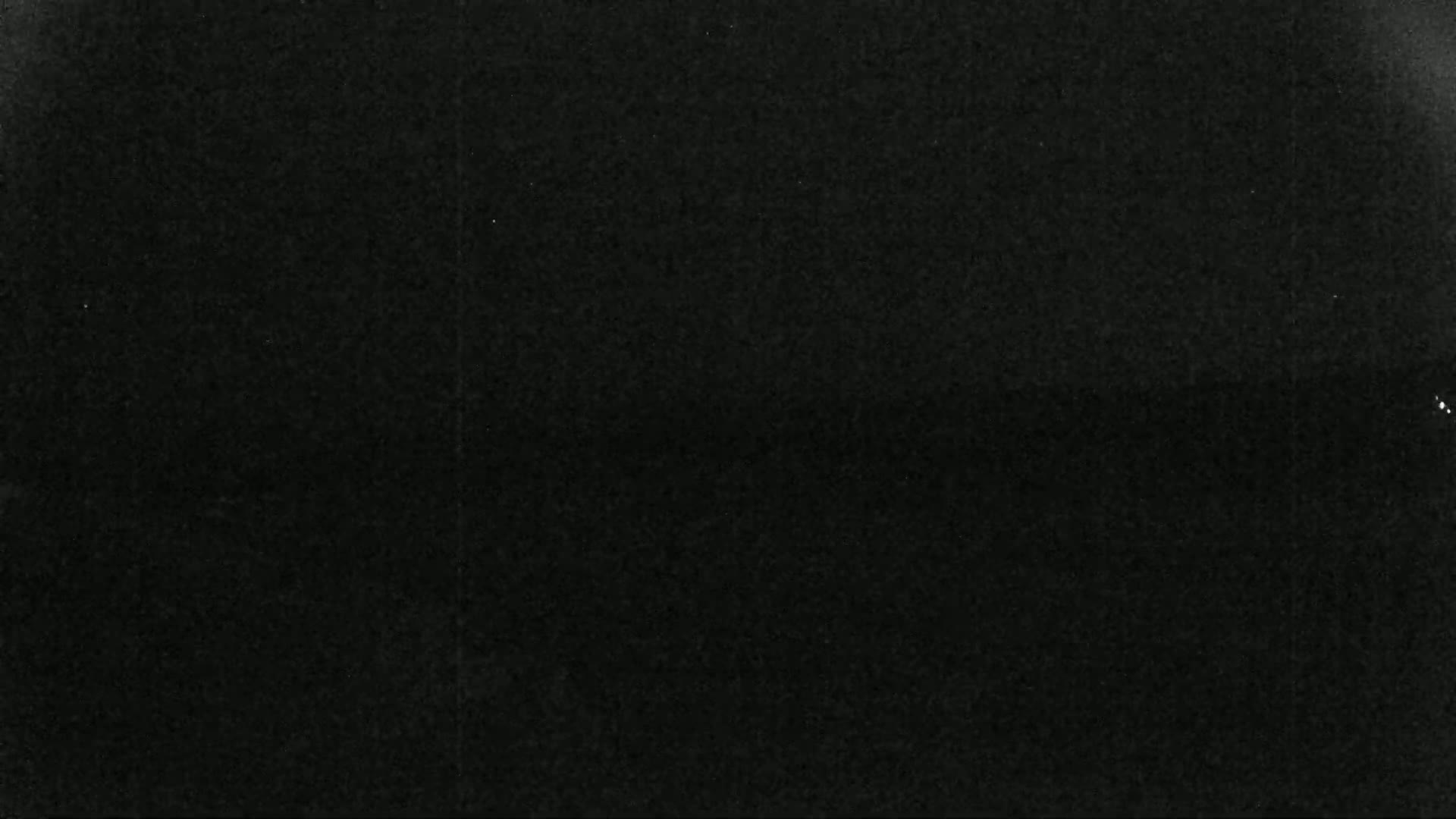 The image shows a uniformly dark gray or black textured surface.