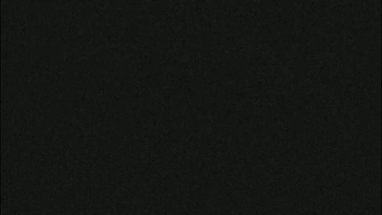 The image is a uniformly dark gray-black textured surface.