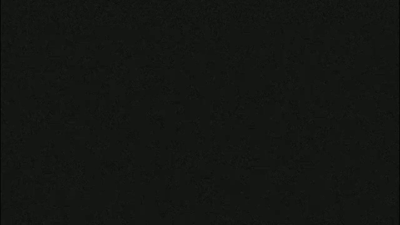 The image is a solid, dark-grey-black color.