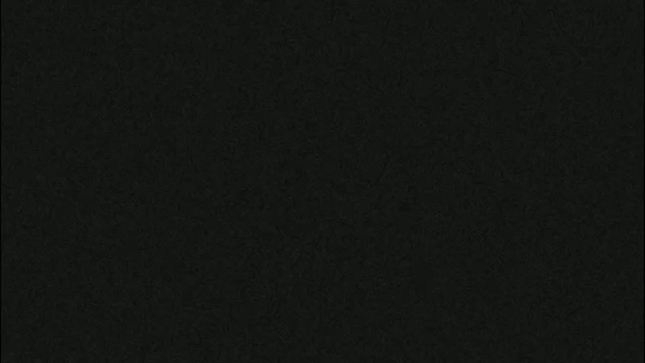 A uniformly dark gray textured surface fills the image.