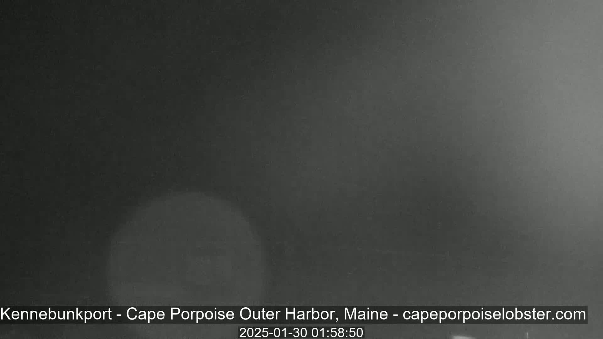 A dark, nighttime image shows an overcast sky.