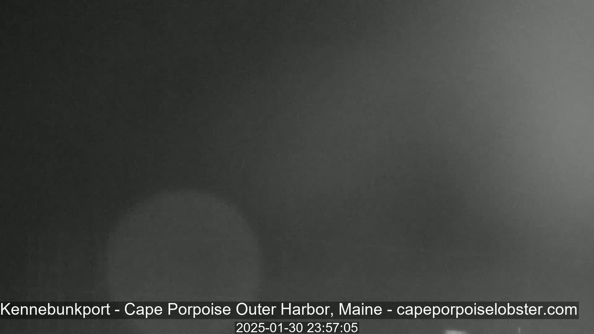 A dark, blurry image shows a mostly featureless night scene.