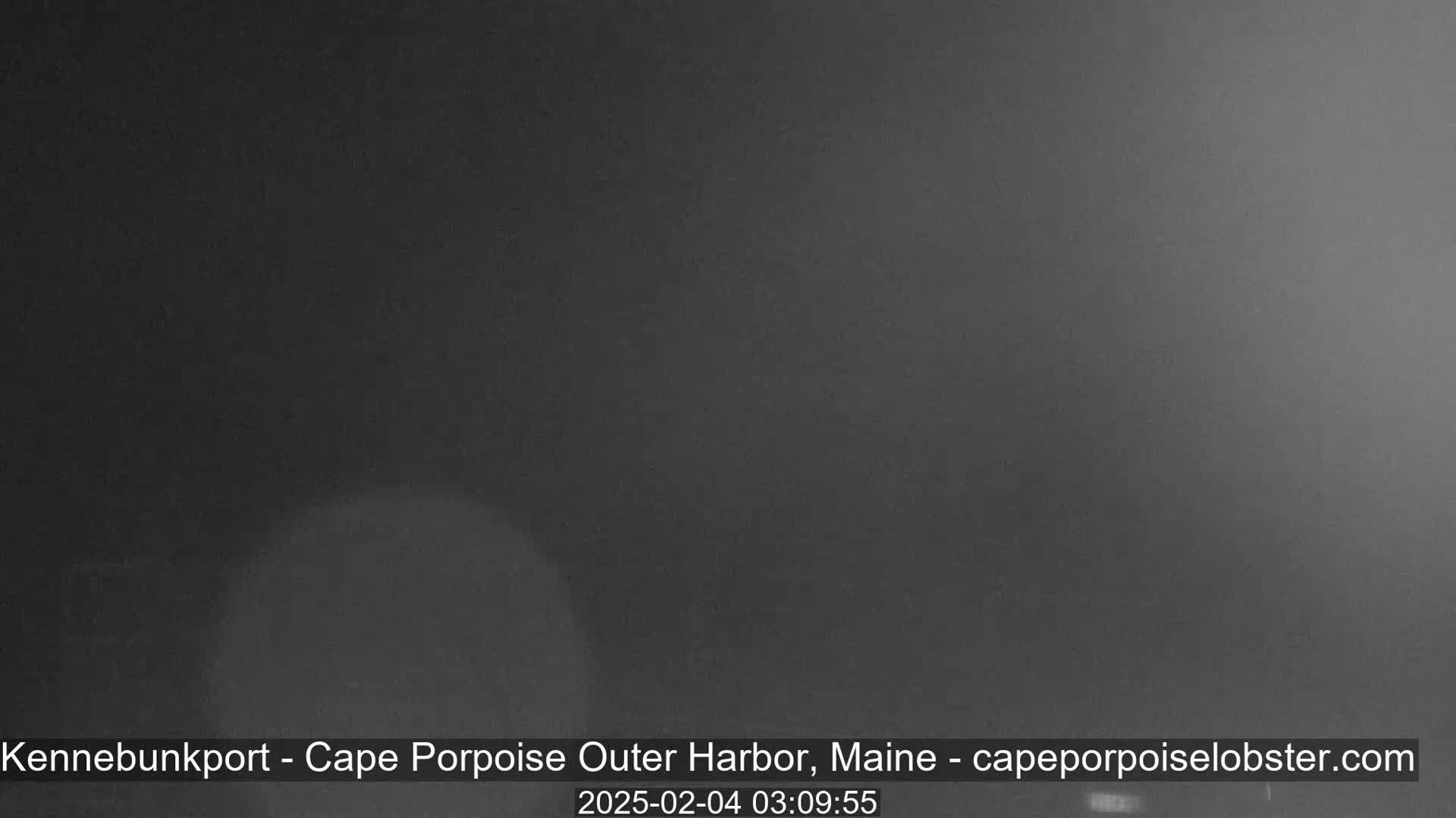 A dark, blurry image shows an overcast night sky.