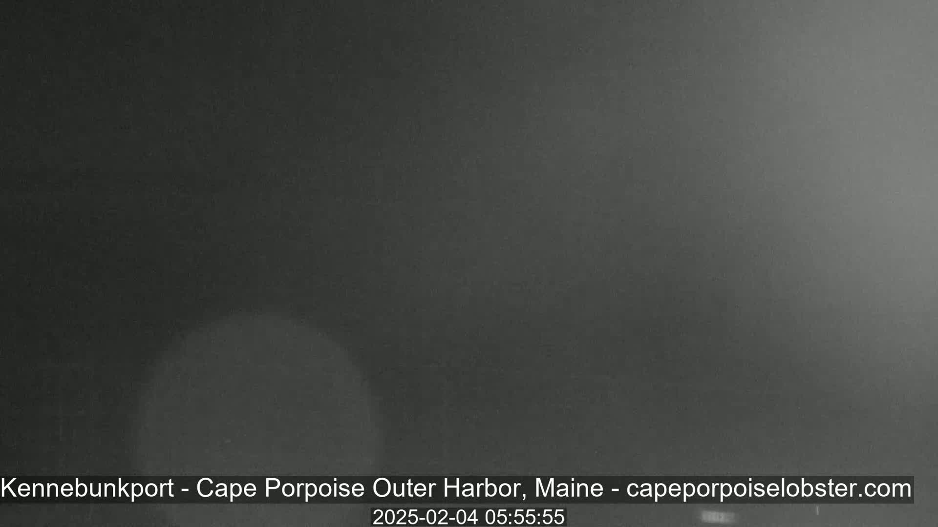 A dark, blurry image shows an overcast sky at night.
