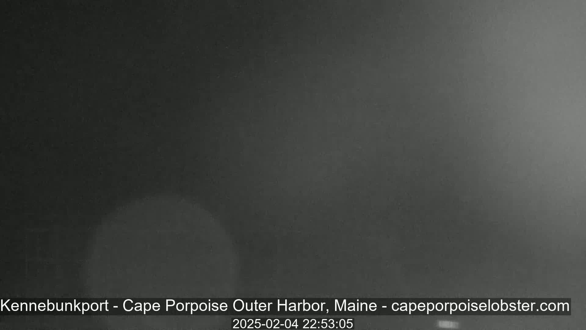 A dark, nighttime image shows an overcast sky.