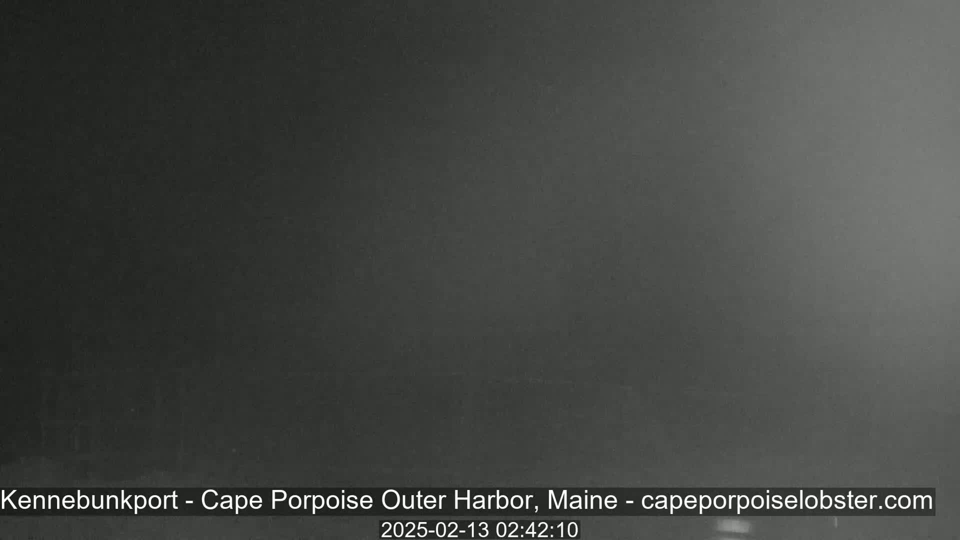A dark, nighttime image shows an overcast sky.