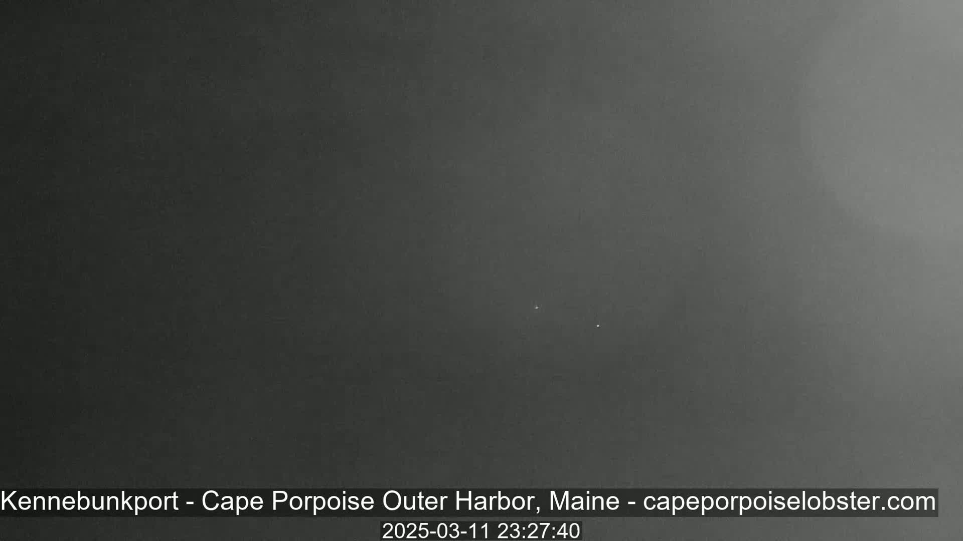 A dark, overcast nighttime scene is shown.
