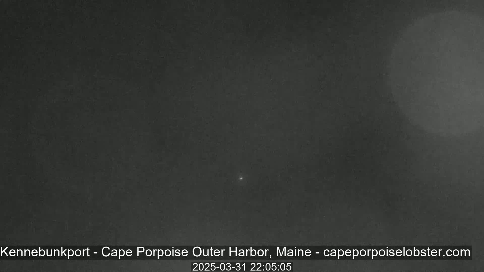 A dark night sky shows a single, small point of light.