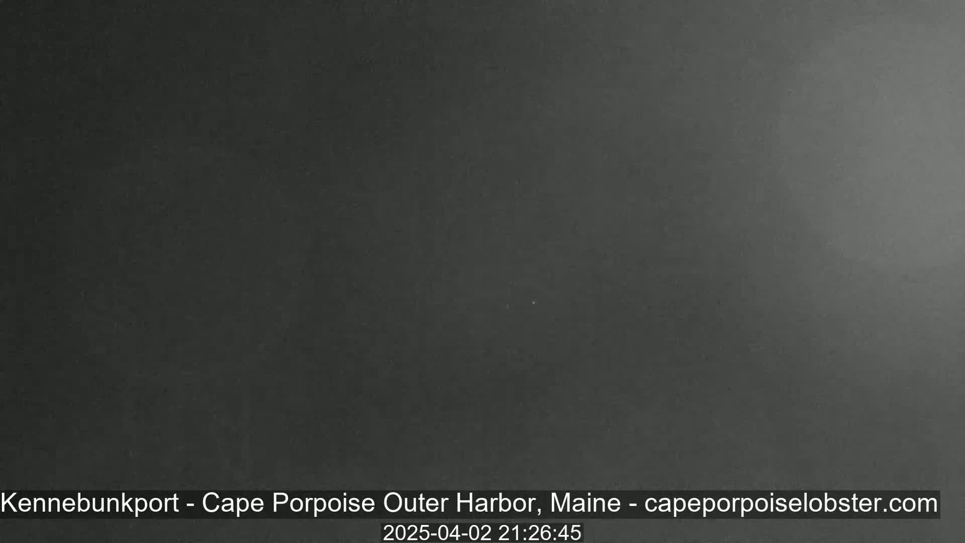 A dark, nighttime image shows a uniformly gray-black sky.
