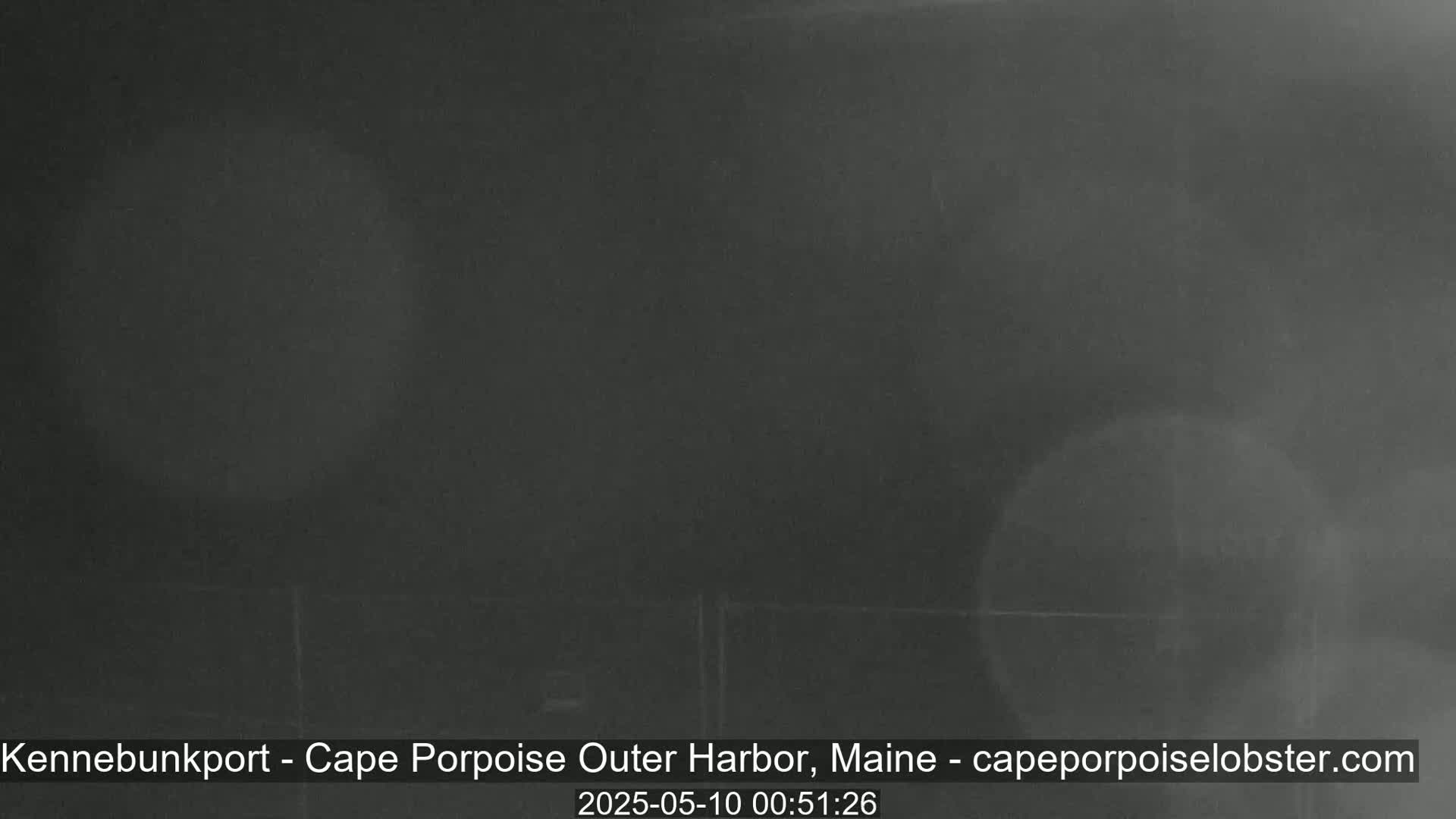 A dark, blurry image shows an indistinct, nighttime view.