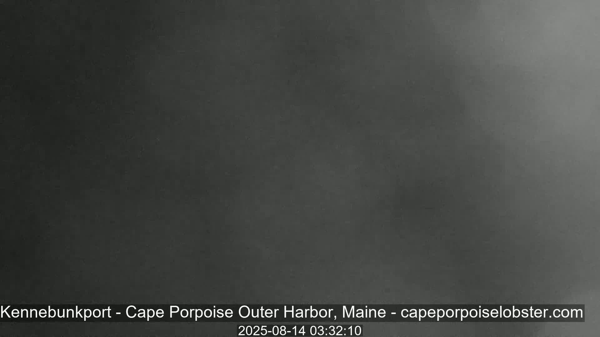 A dark, blurry image shows an overcast sky at night.