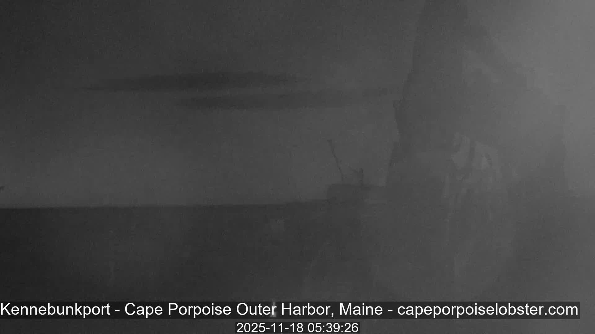 The image displays an extremely dark, featureless scene, indicative of nighttime conditions outdoors where no light sources or objects are visible.