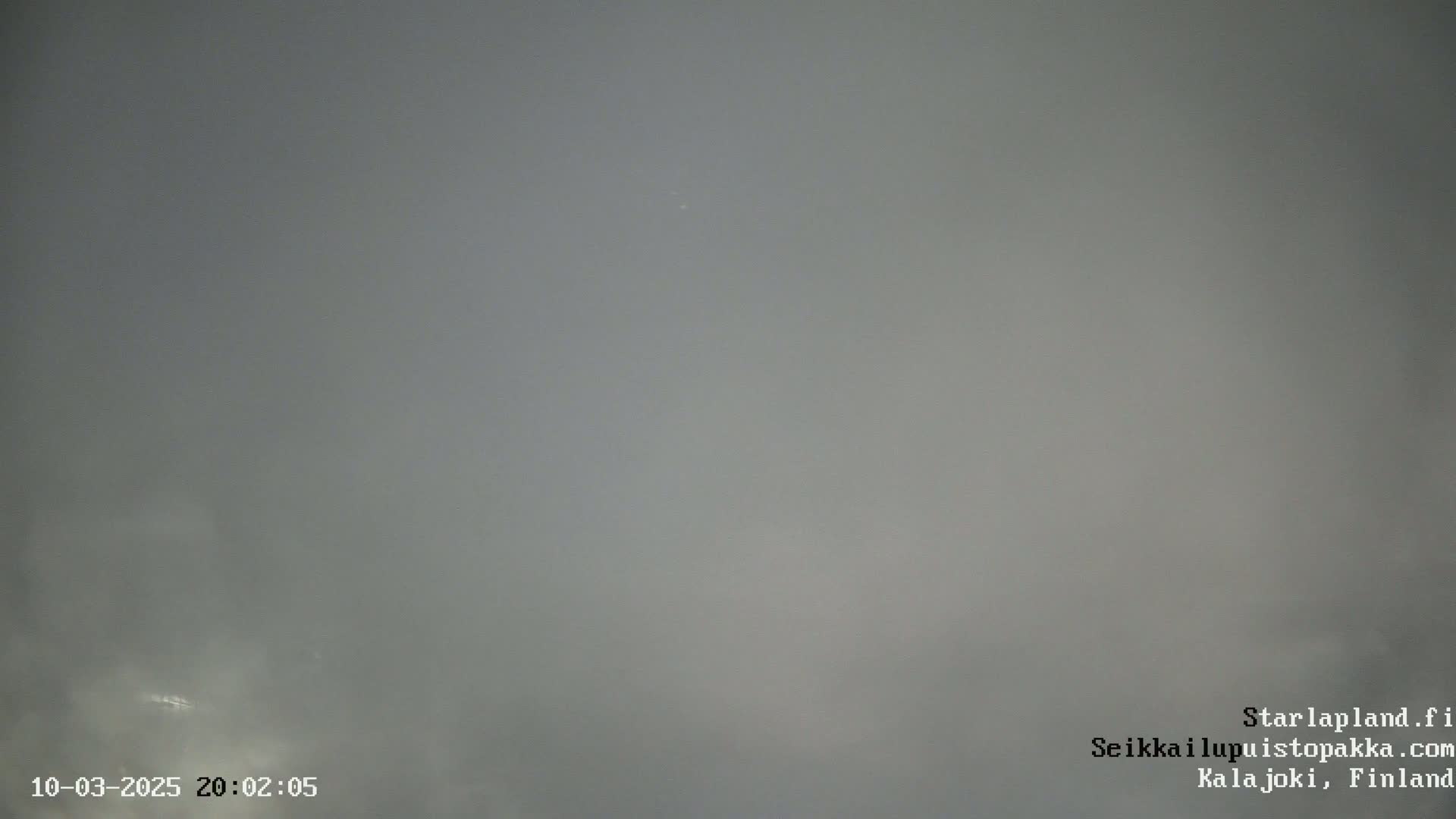 A very foggy or hazy gray sky is visible.