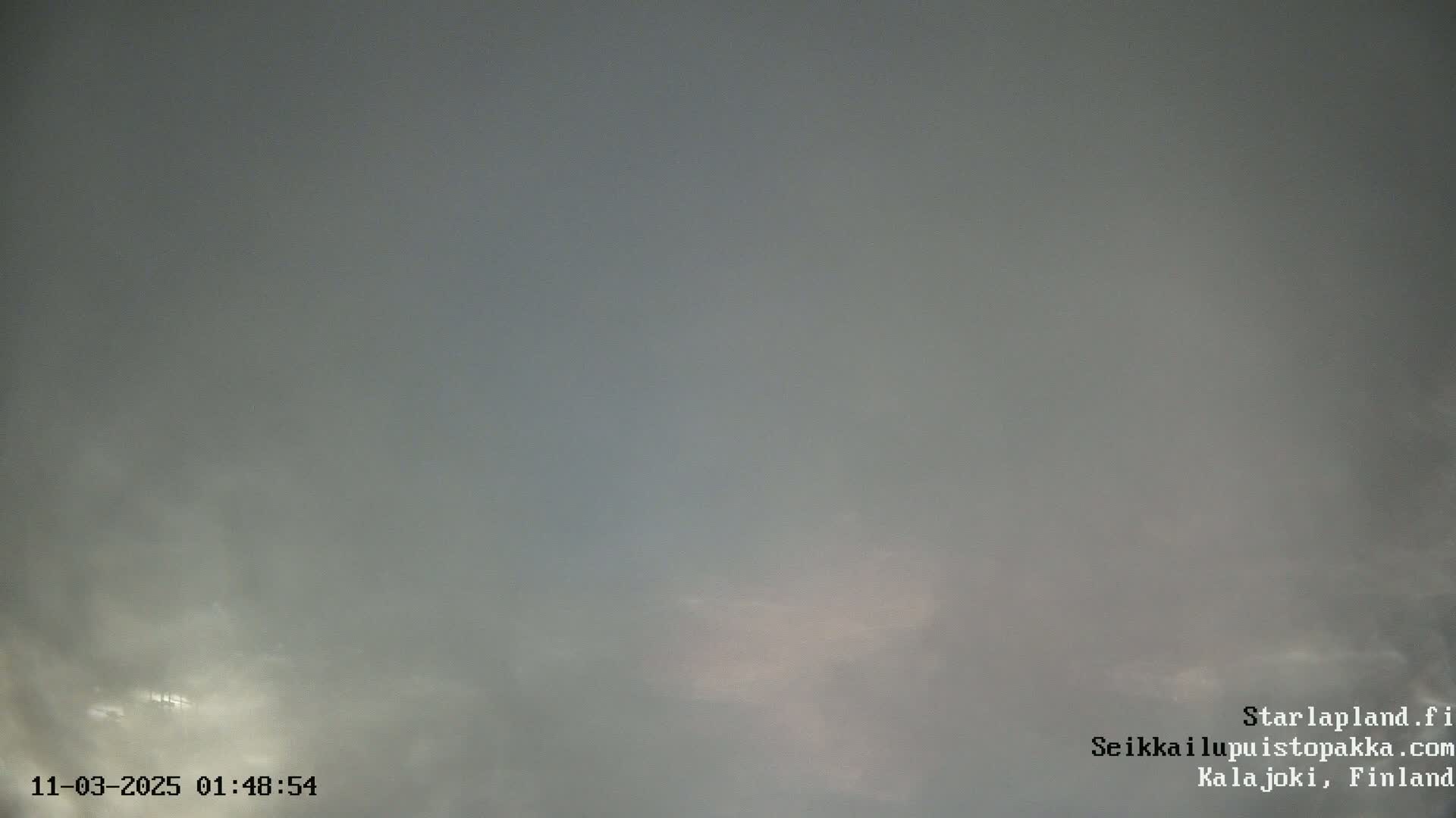 A mostly overcast sky with faint hints of lighter clouds.