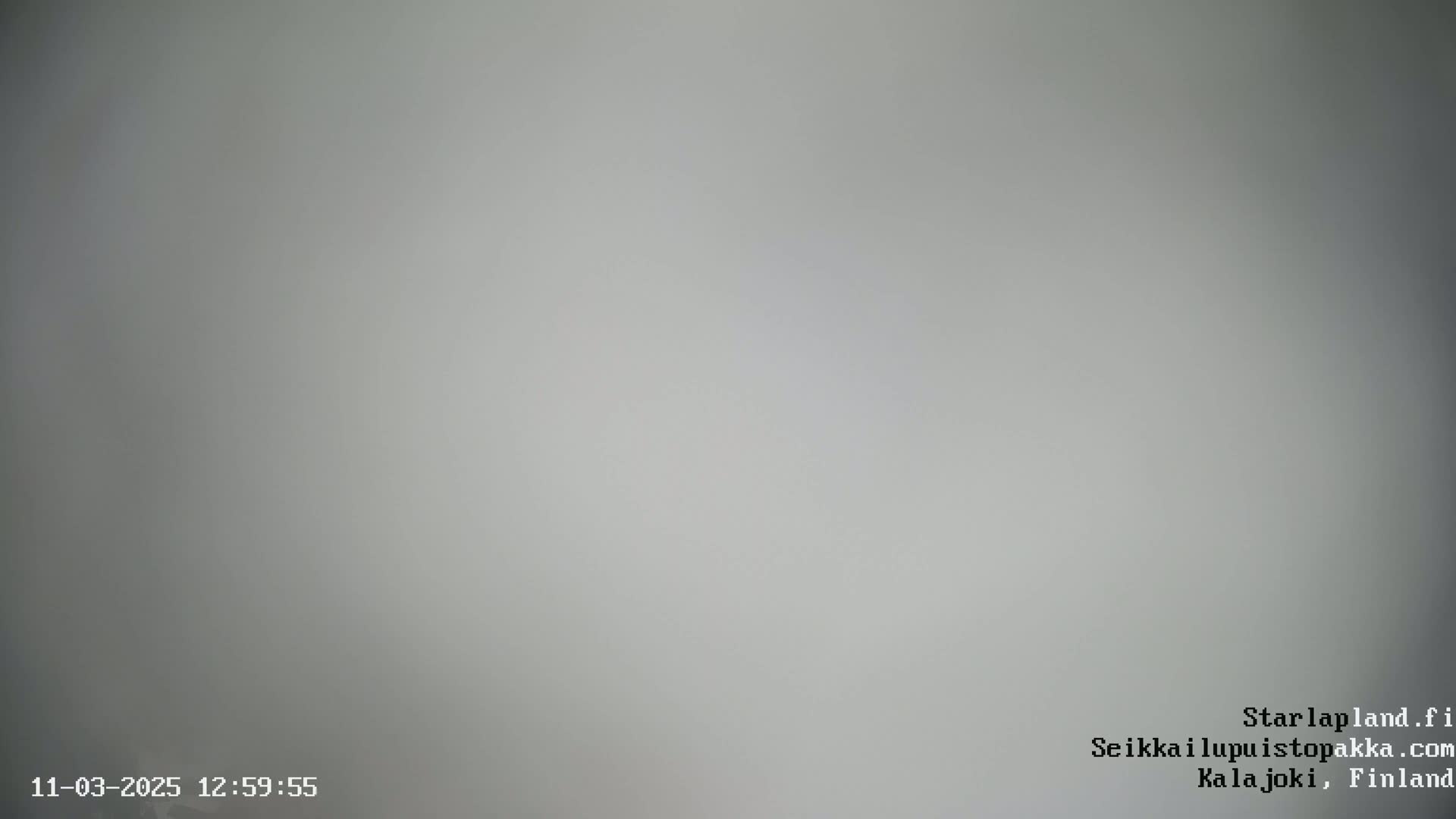 A uniformly light gray image shows an overcast sky.