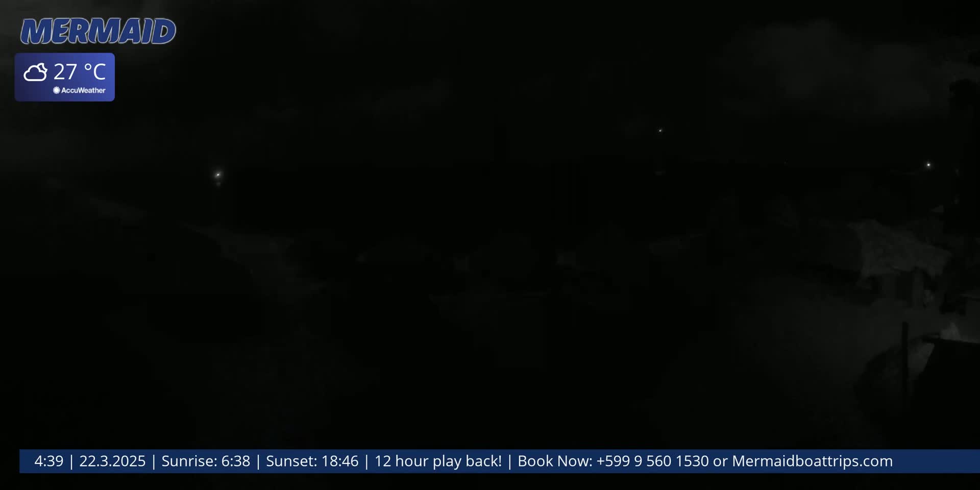 A dark, nighttime outdoor scene with a cloudy sky and a temperature of 27°C.