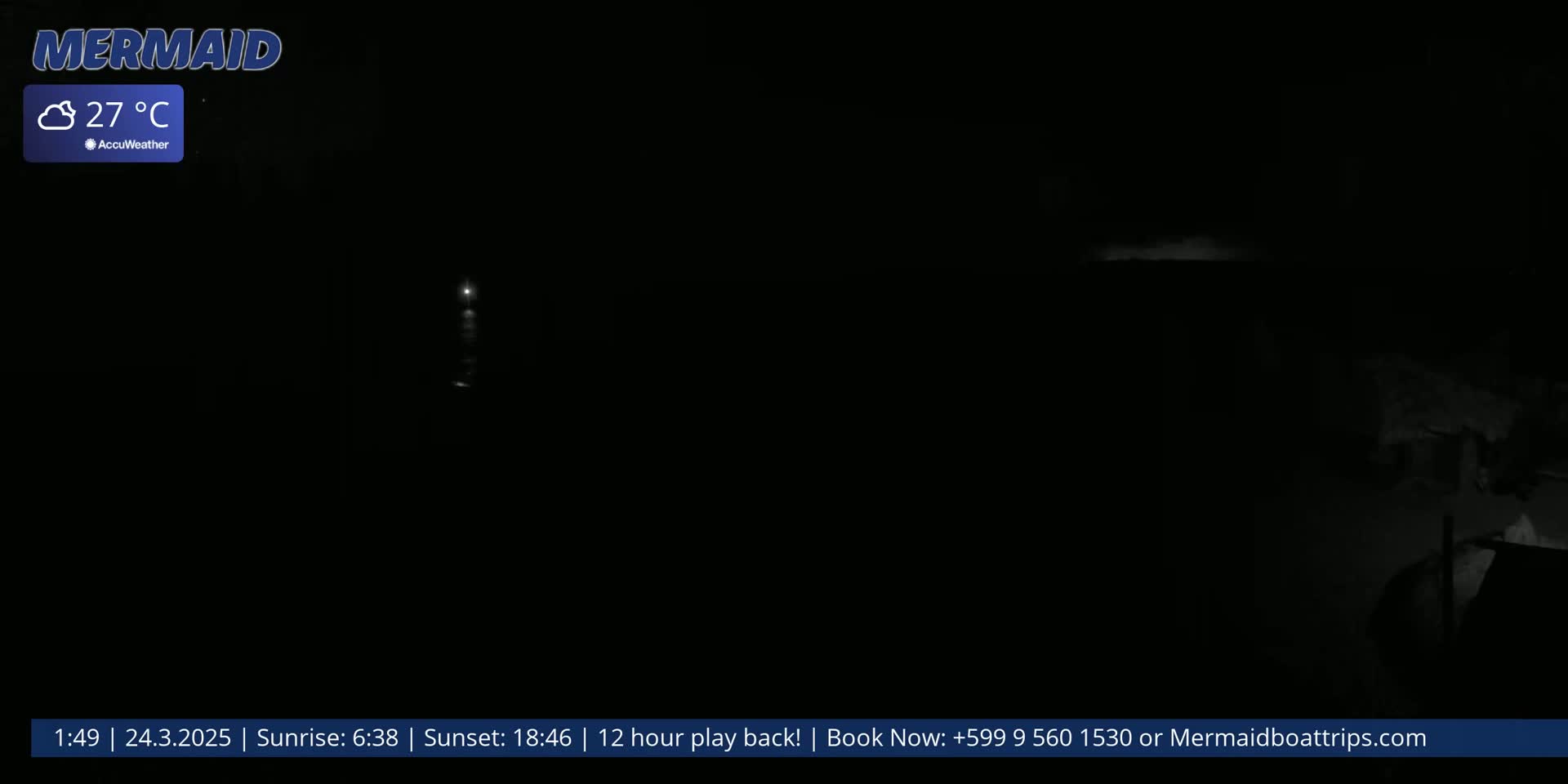 A nighttime, mostly dark scene shows a faint light source in the distance under a clear sky at 27°C.