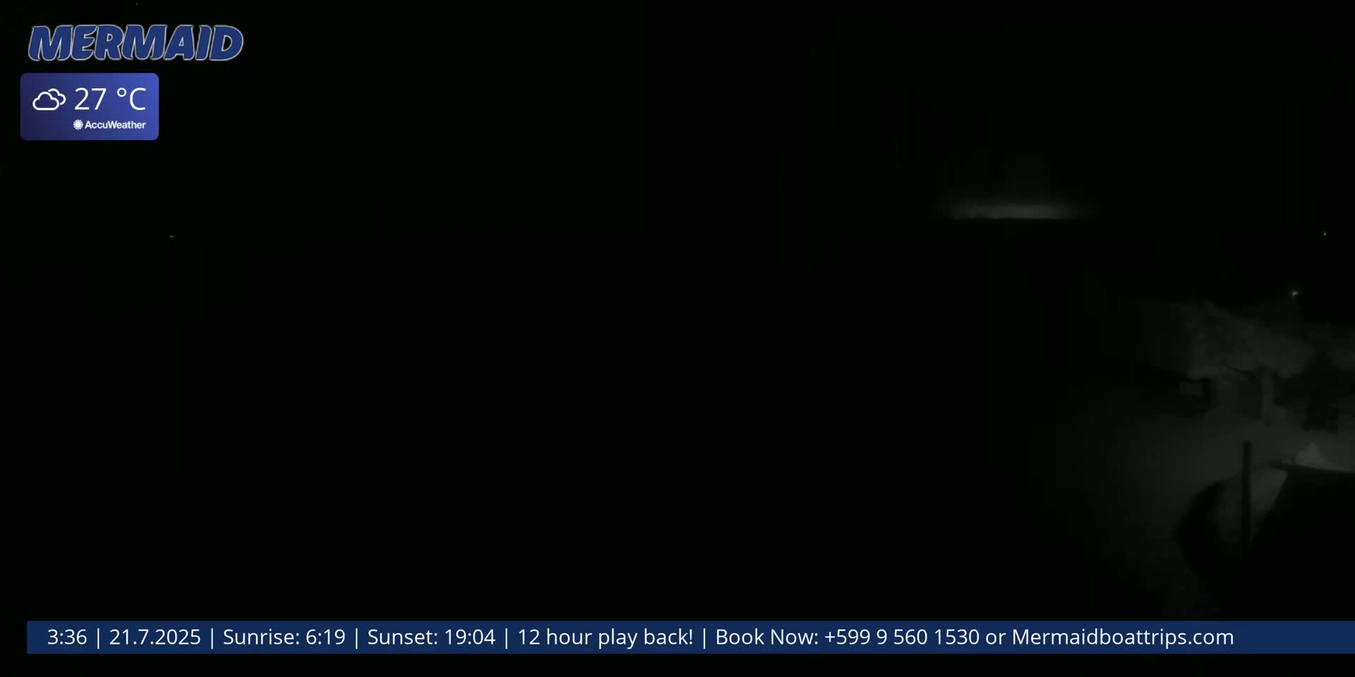 A nighttime, cloudy outdoor scene shows a dimly lit area with some indistinct structures, the air temperature is 27°C.