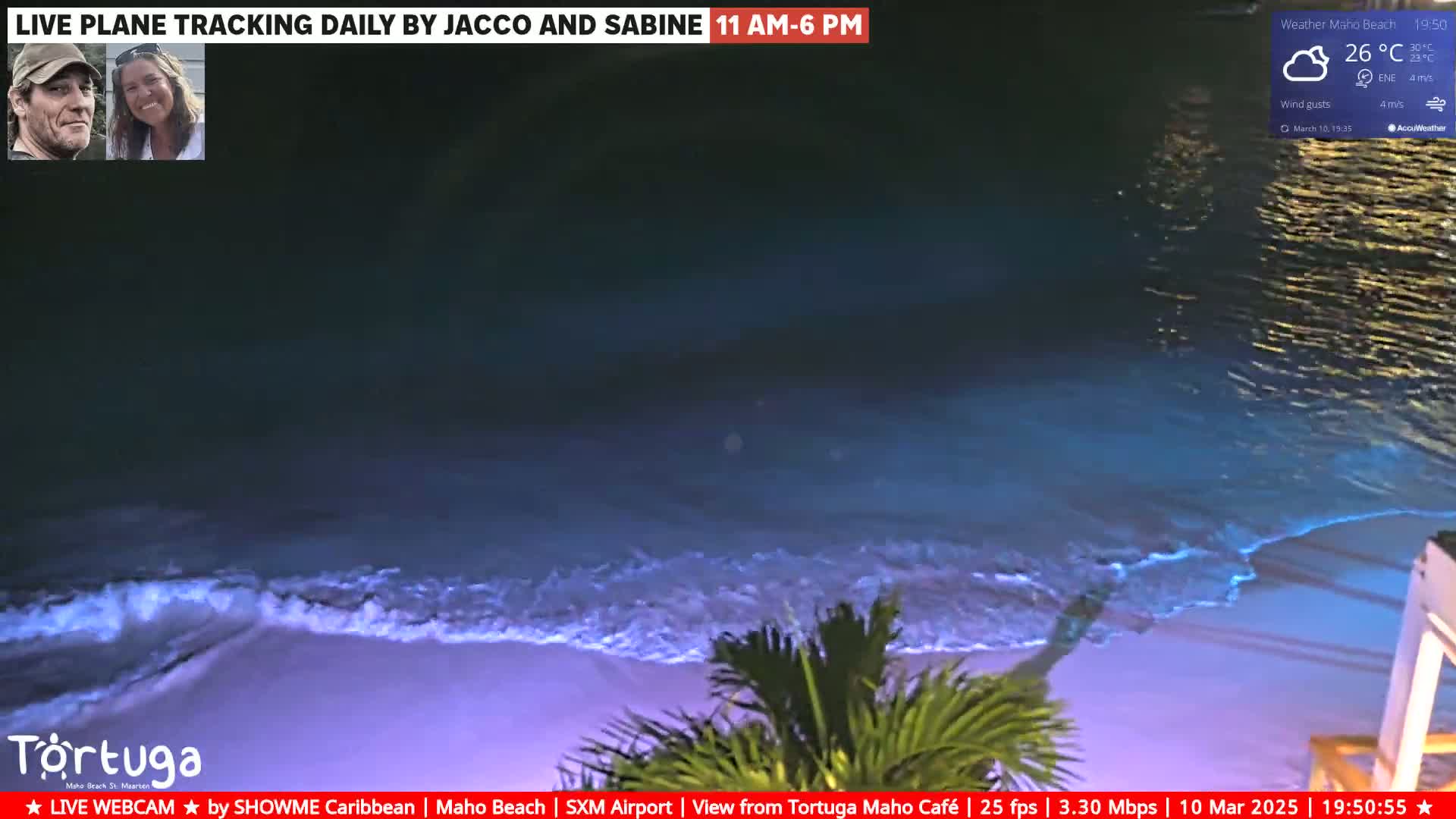 A nighttime beach scene shows gently lapping waves on a sandy shore under a cloudy sky with a 26°C temperature and 4 m/s wind.