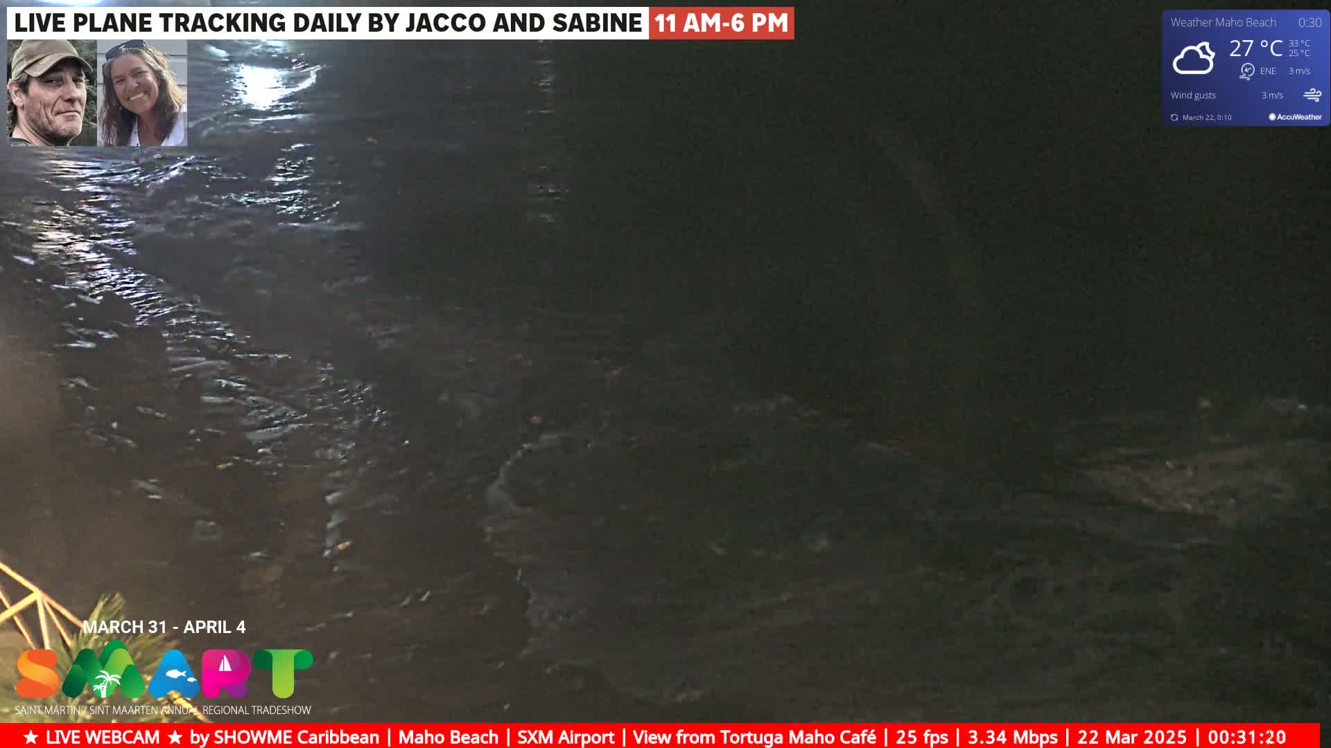 A nighttime view of dark, choppy water under a cloudy sky with a temperature of 27°C.