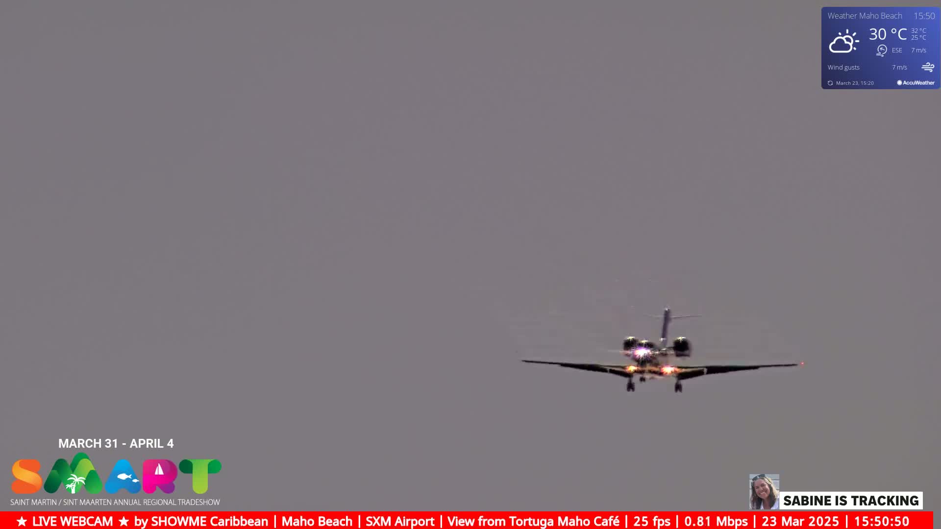 A private jet is landing under partly cloudy skies with a temperature of 30 degrees Celsius.