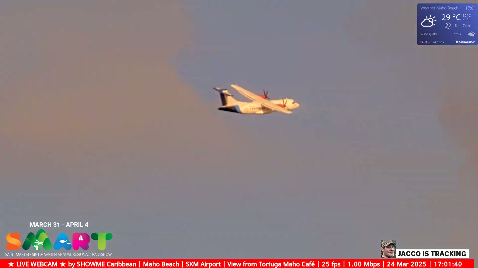 A turboprop airplane flies in a hazy, light-brown sky.